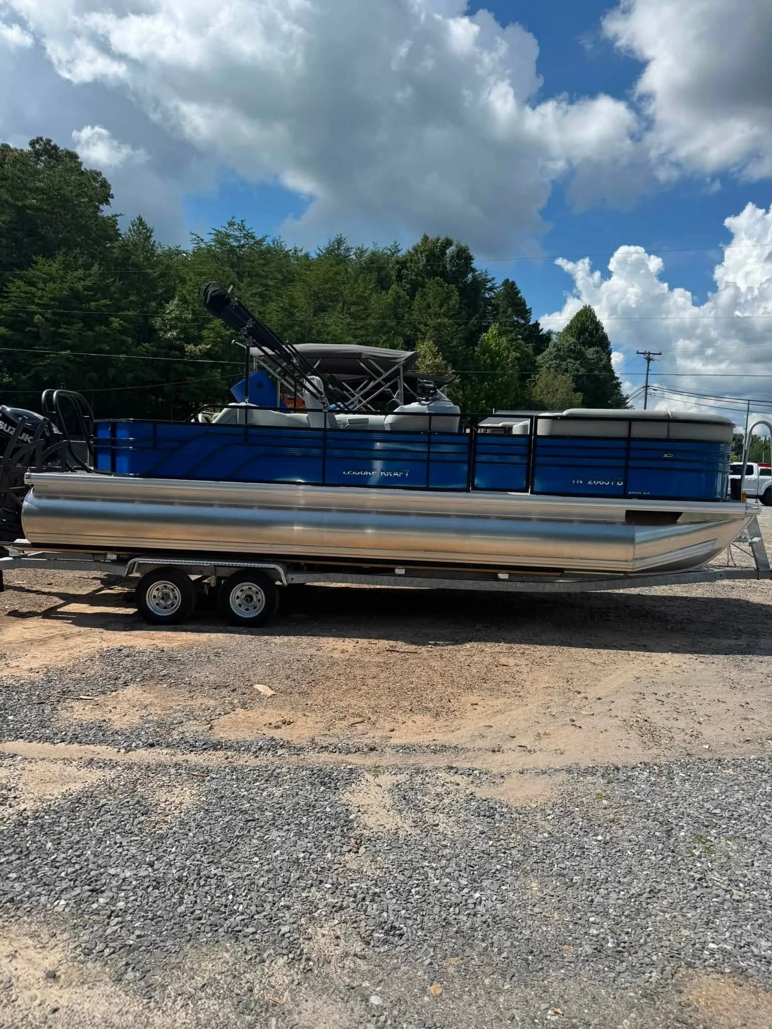 24' Leisure Kraft Pontoons made in Crossville, Tennessee parked on trailer ready for a day on the lake