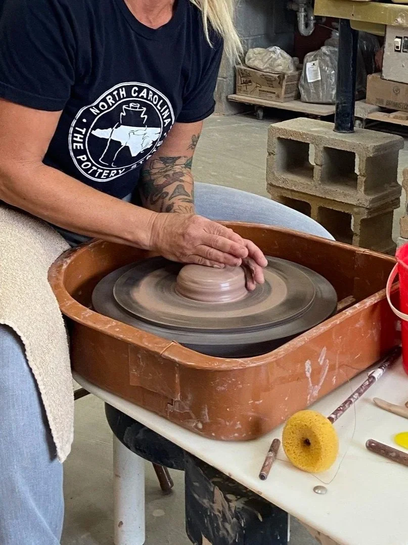 Close up view of a pottery demonstration.