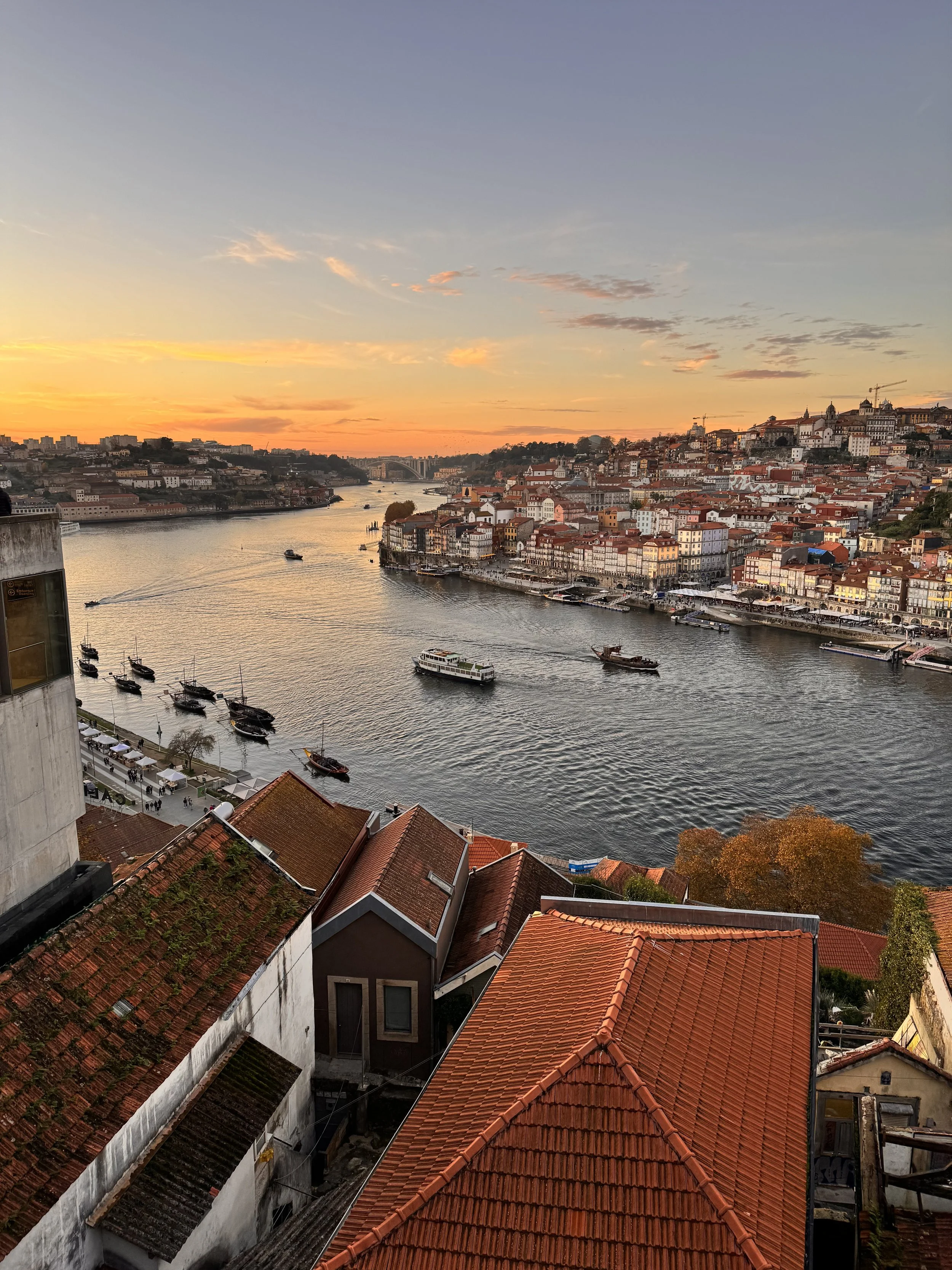 Shoreline along the Douro River in Porto, Portugal at sunset