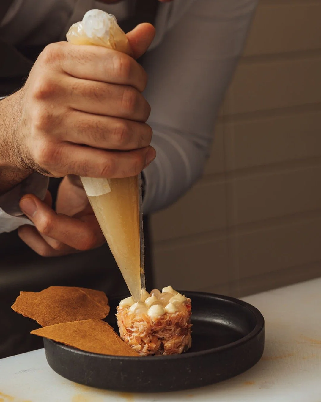 Care /ker/ (n.)
The intention shaping something before it is shared.

It&rsquo;s there in the sweetness of our Jonah crab salad, a gentle spark of fermented pepper and a quiet brightness, citrus trailing behind like sun on saltwater.

At Kaia, care i