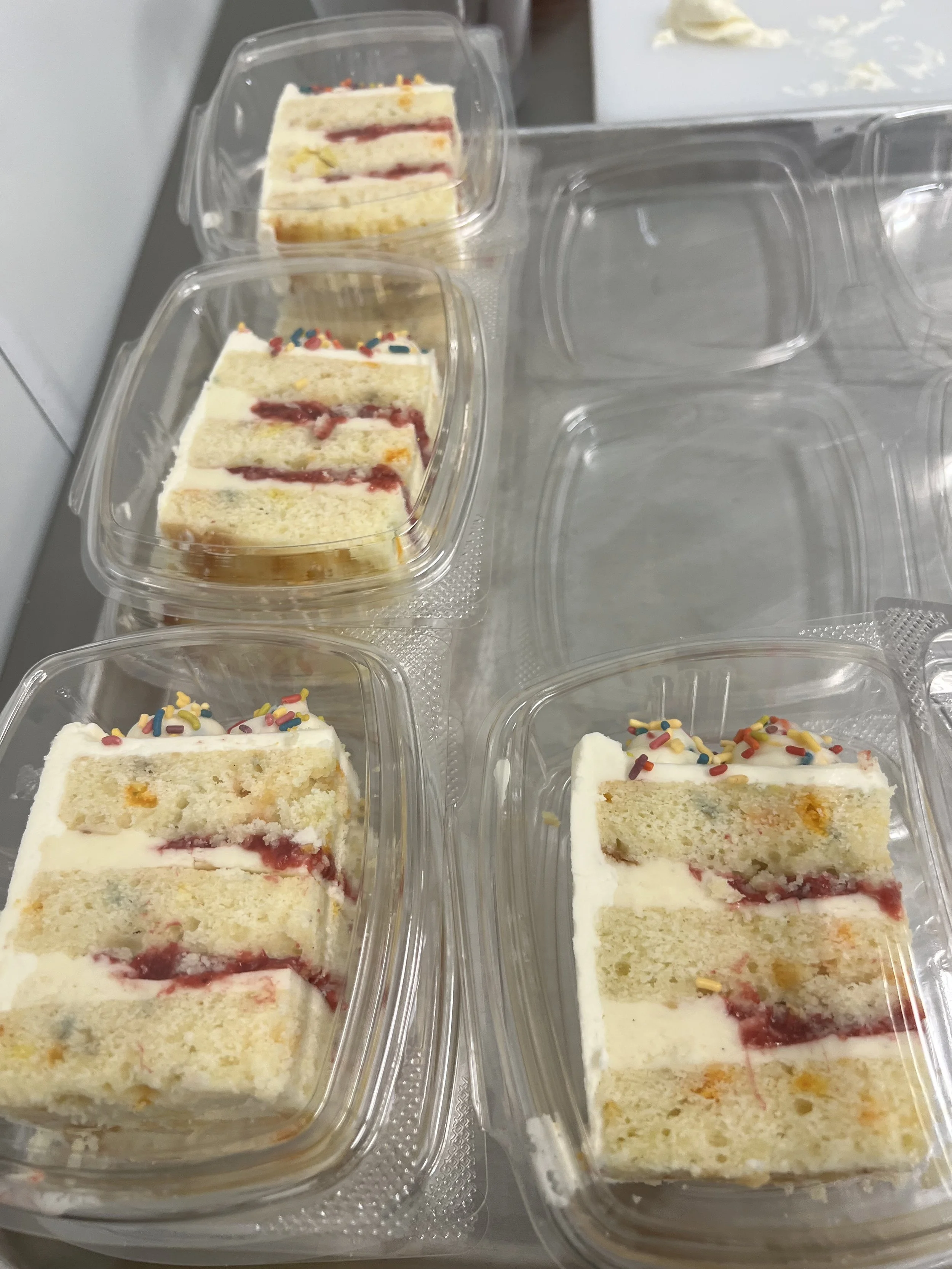 birthday cake slice: buttermilk vanilla cake, roasted strawberry kiwi jam, mascarpone cream, funfetti frosting.