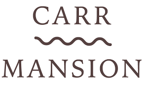 Logo with the words 'CARR MANSION' and a wavy line between them