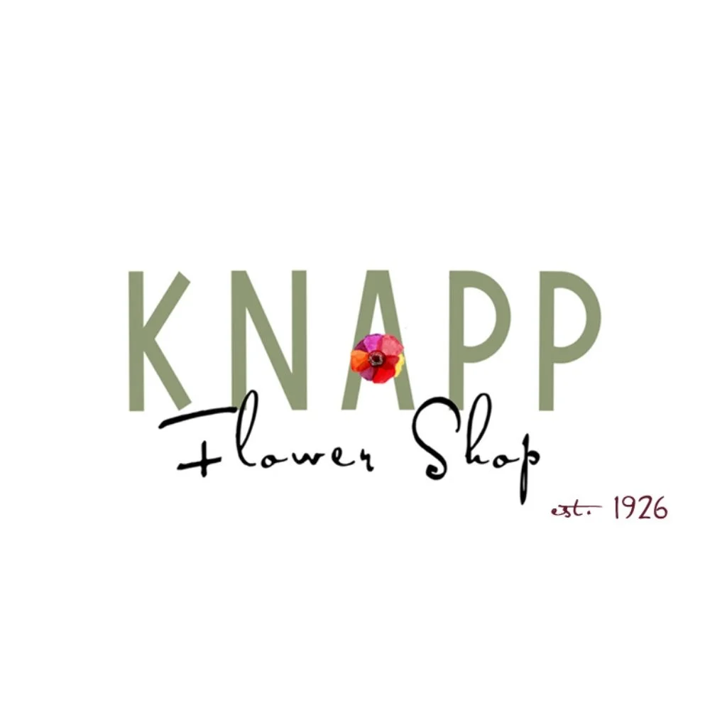 Logo for Knapp Flower Shop featuring the shop name in green letters with a small colorful flower graphic between the words, and the words 'Flower Shop' in cursive underneath, with 'est. 1926' written in small text in the bottom right corner.