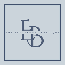 Logo for The Engagement Boutique with stylized letters and a gray background.