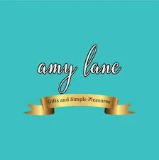 Logo with the text 'amy lane' and a gold ribbon banner that says 'Gifts and Simple Pleasures' on a teal background.