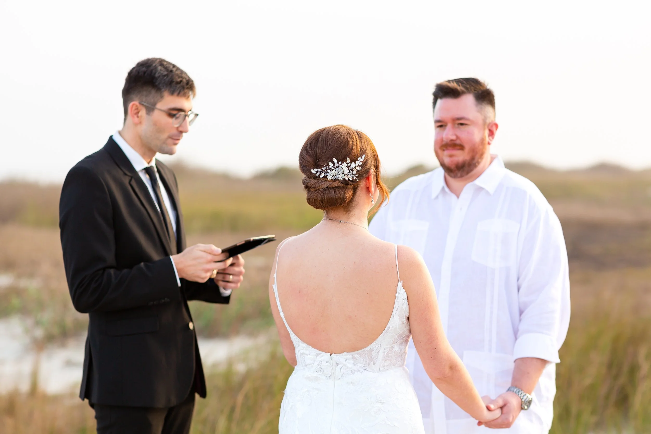 Small ceremony setup on the sand with ocean in the background