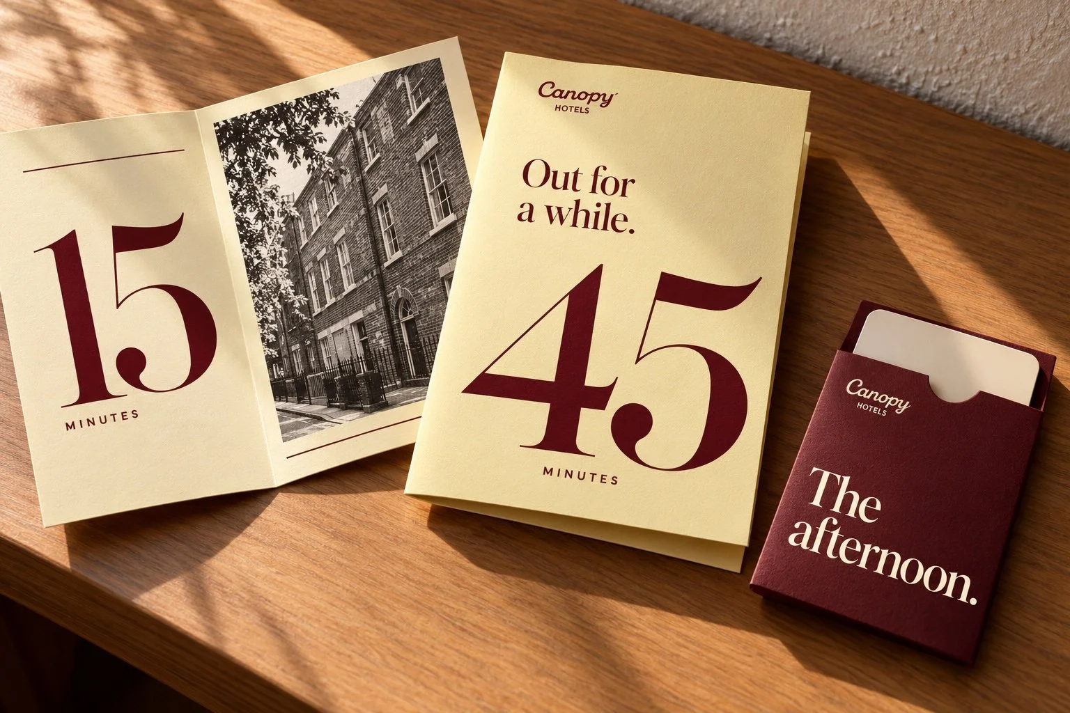 Speculative Canopy pocket folios in butter yellow and burgundy, with oversized 15 and 45 minute numerals and a matching key wallet