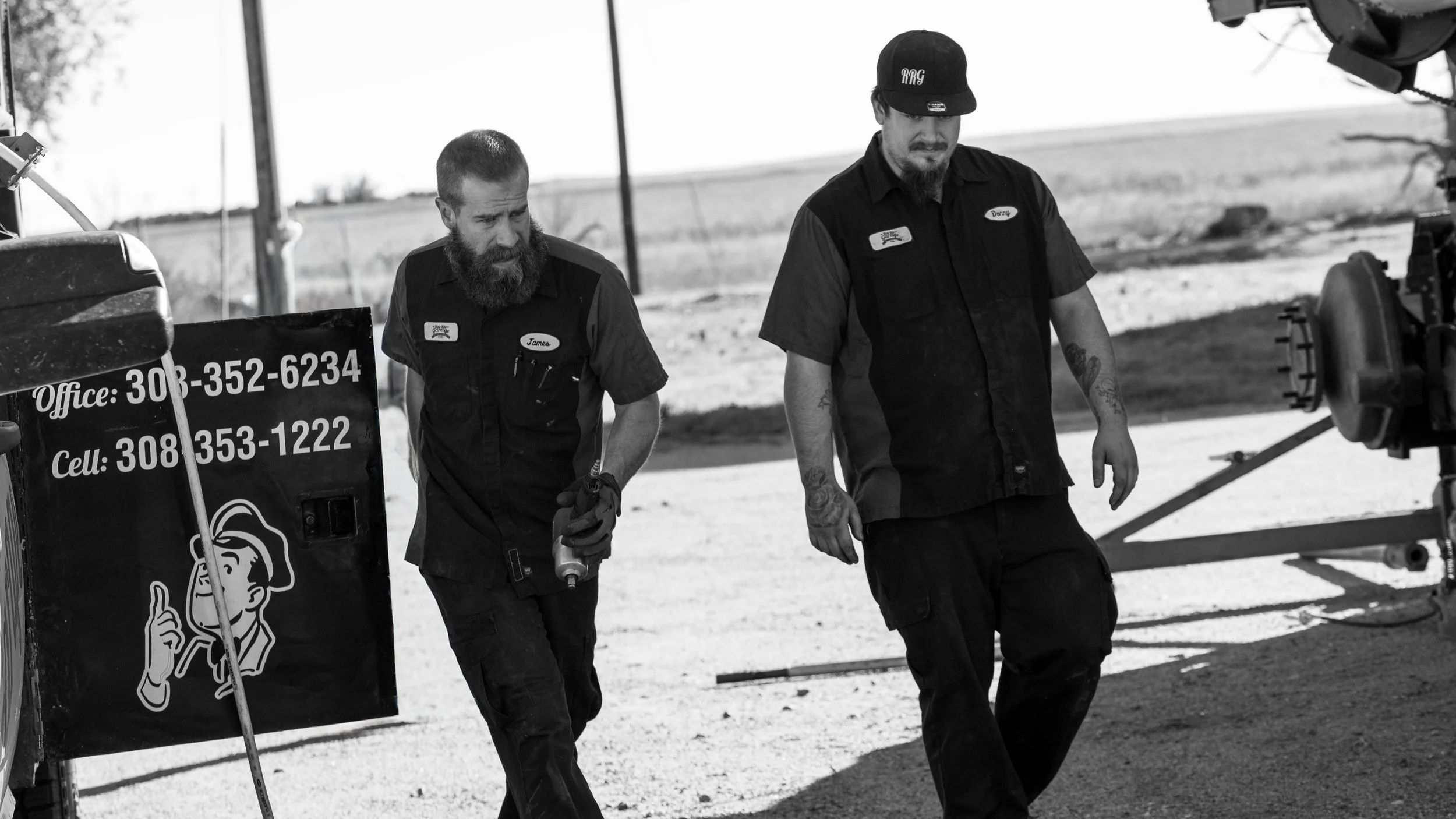 an emergency roadside assistance truck sits on a road in southwest nebraska near a farm