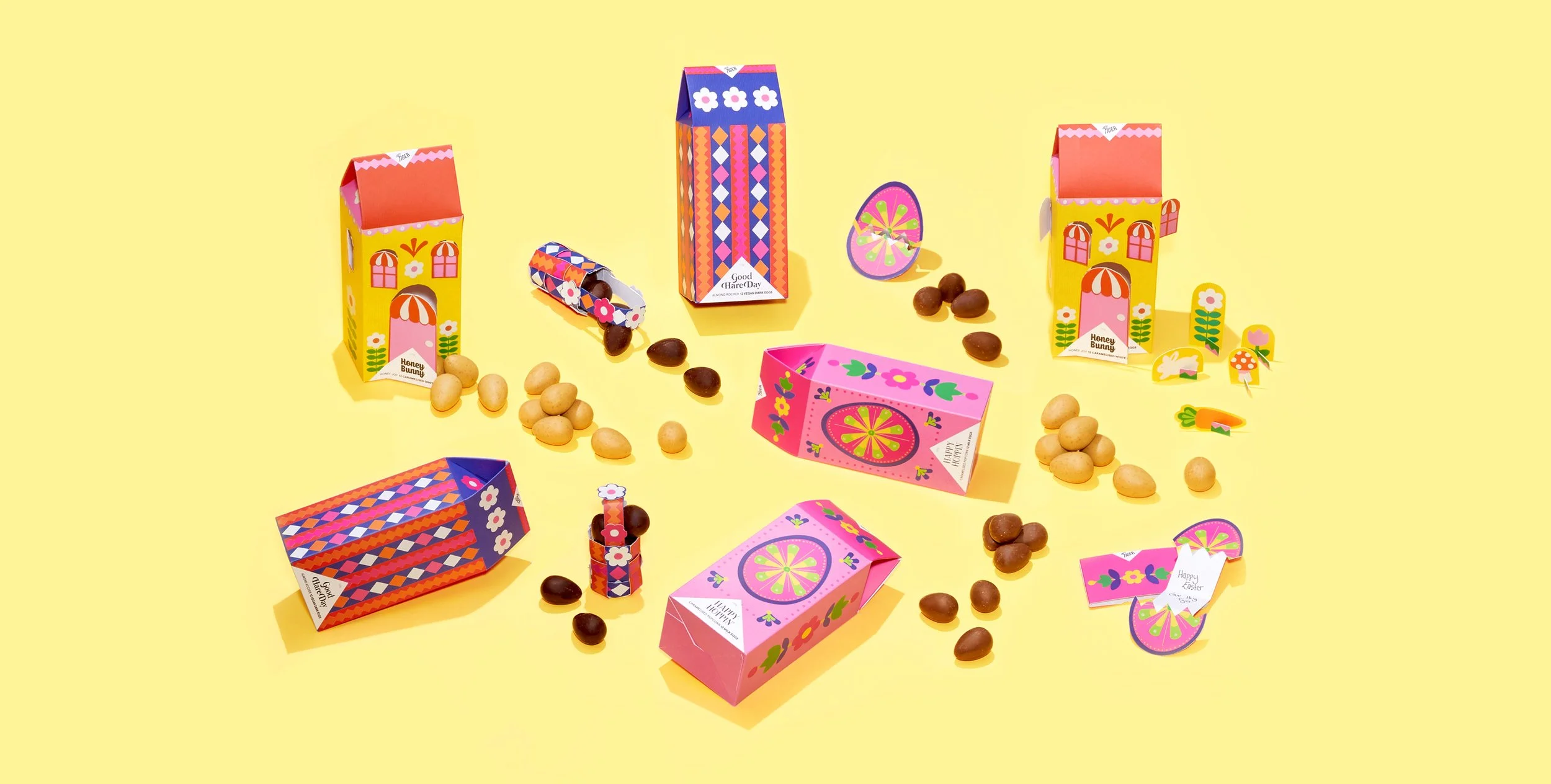 Colourful packaging design for a collection of chocolate bars, designed by Kitiya Palaskas and featuring folk art-inspired papercraft collage illustration in various Easter-themed motifs.