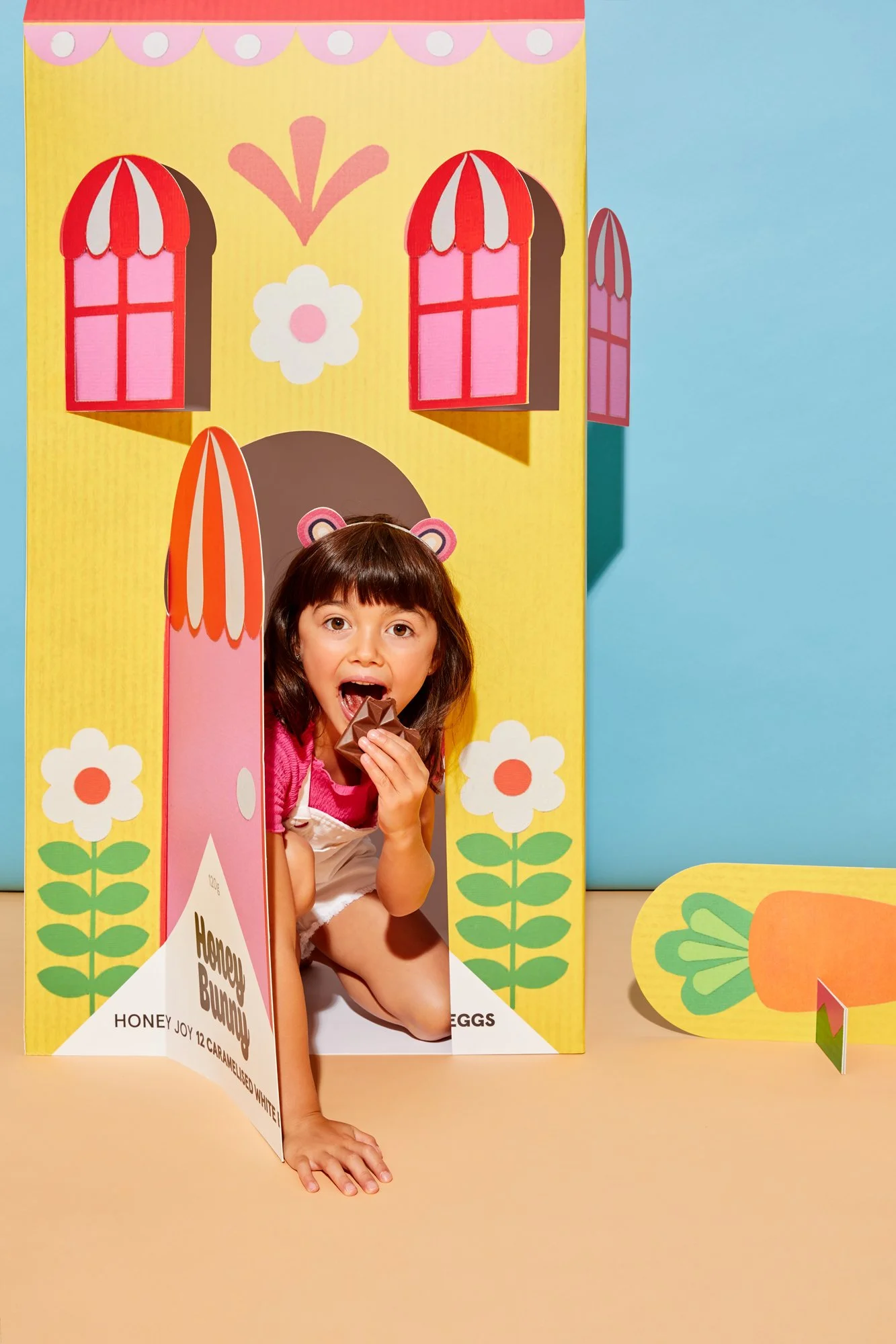Colourful packaging design for a collection of chocolate bars, designed by Kitiya Palaskas and featuring folk art-inspired papercraft collage illustration in various Easter-themed motifs.