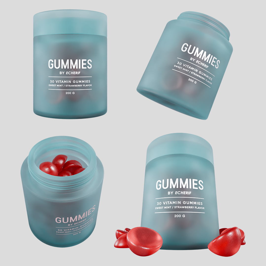 Open container of red vitamin gummies next to a closed container of blue vitamin gummies with a label.