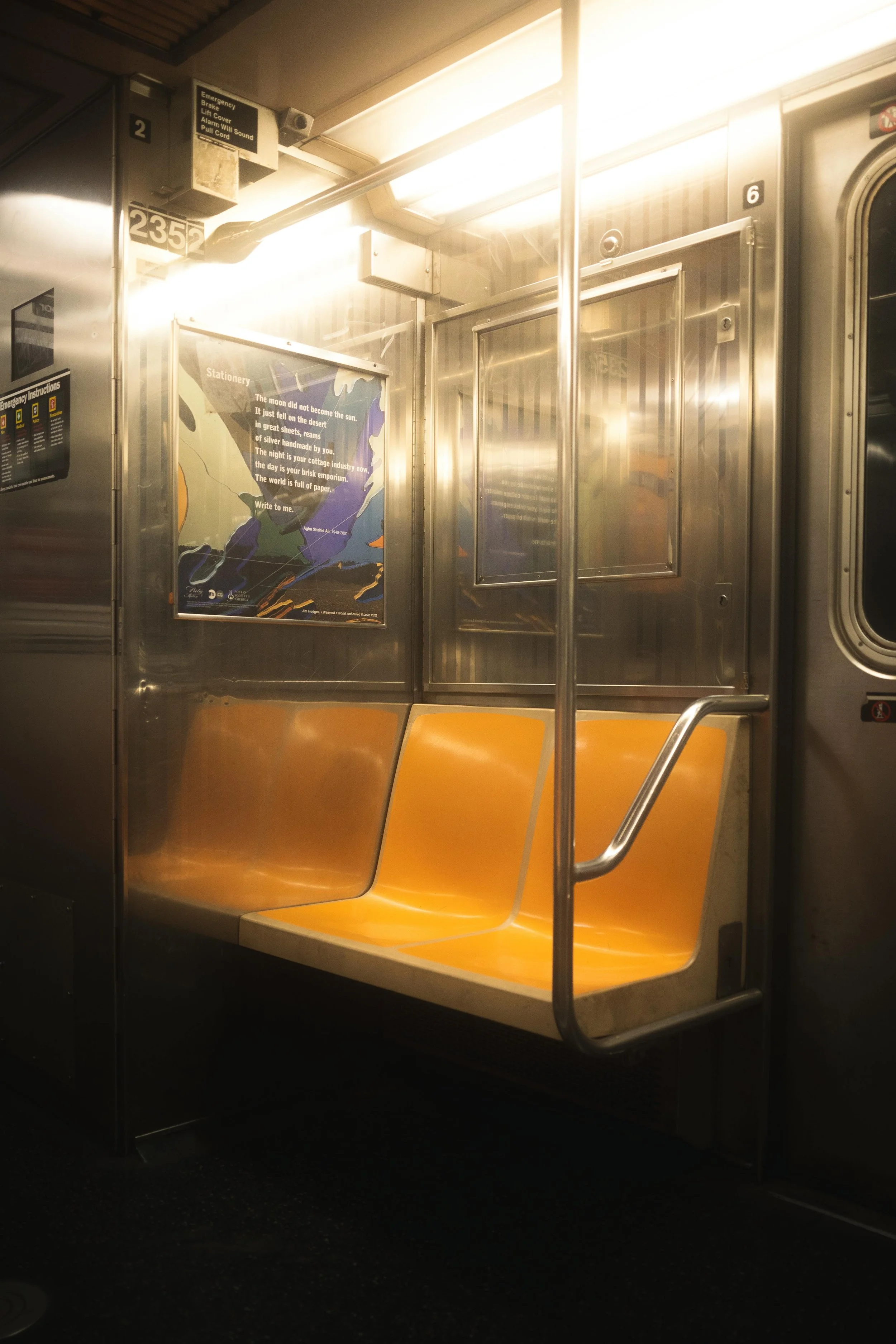 An empty subway car with warm light, evoking solitude, transition, and staying grounded in public.