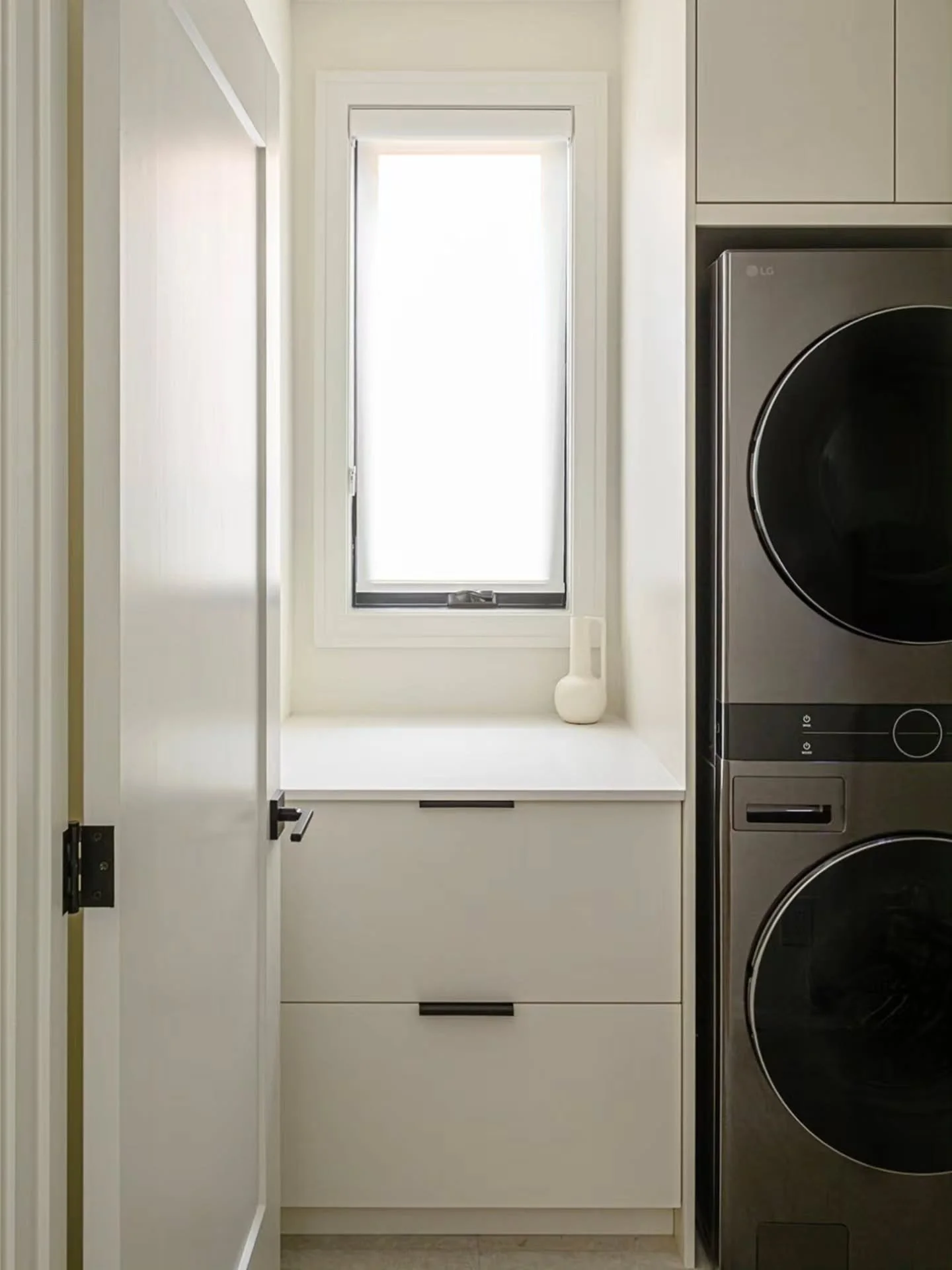 Proof that even the smallest spaces can work beautifully.

This custom laundry room we built for @golden.ridge.homes was designed to maximize every inch, featuring floor-to-ceiling cabinetry.
A seamless home for the stacked washer and dryer. Clean li