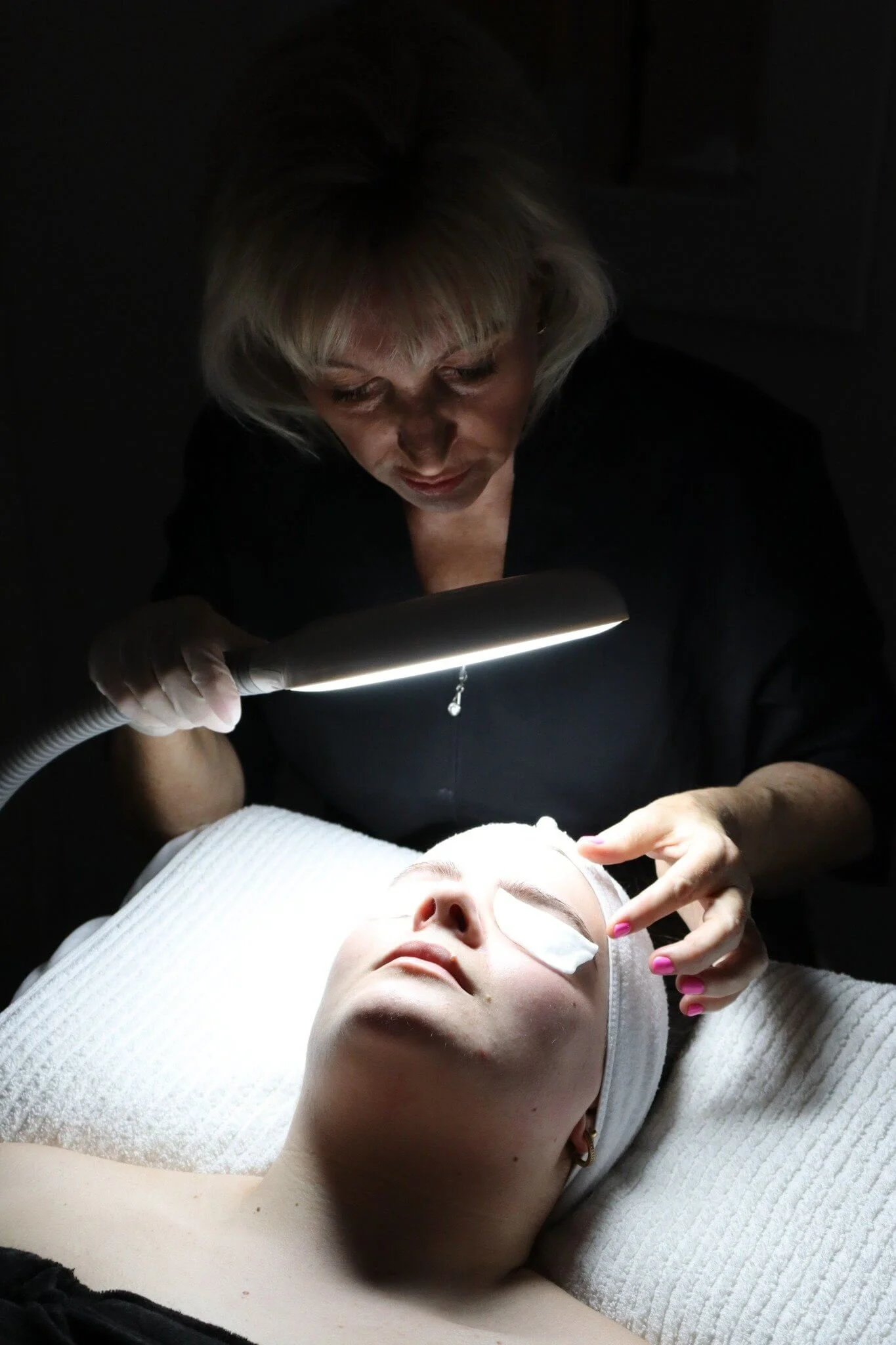 patient having chemical peel treatment applied by Kim