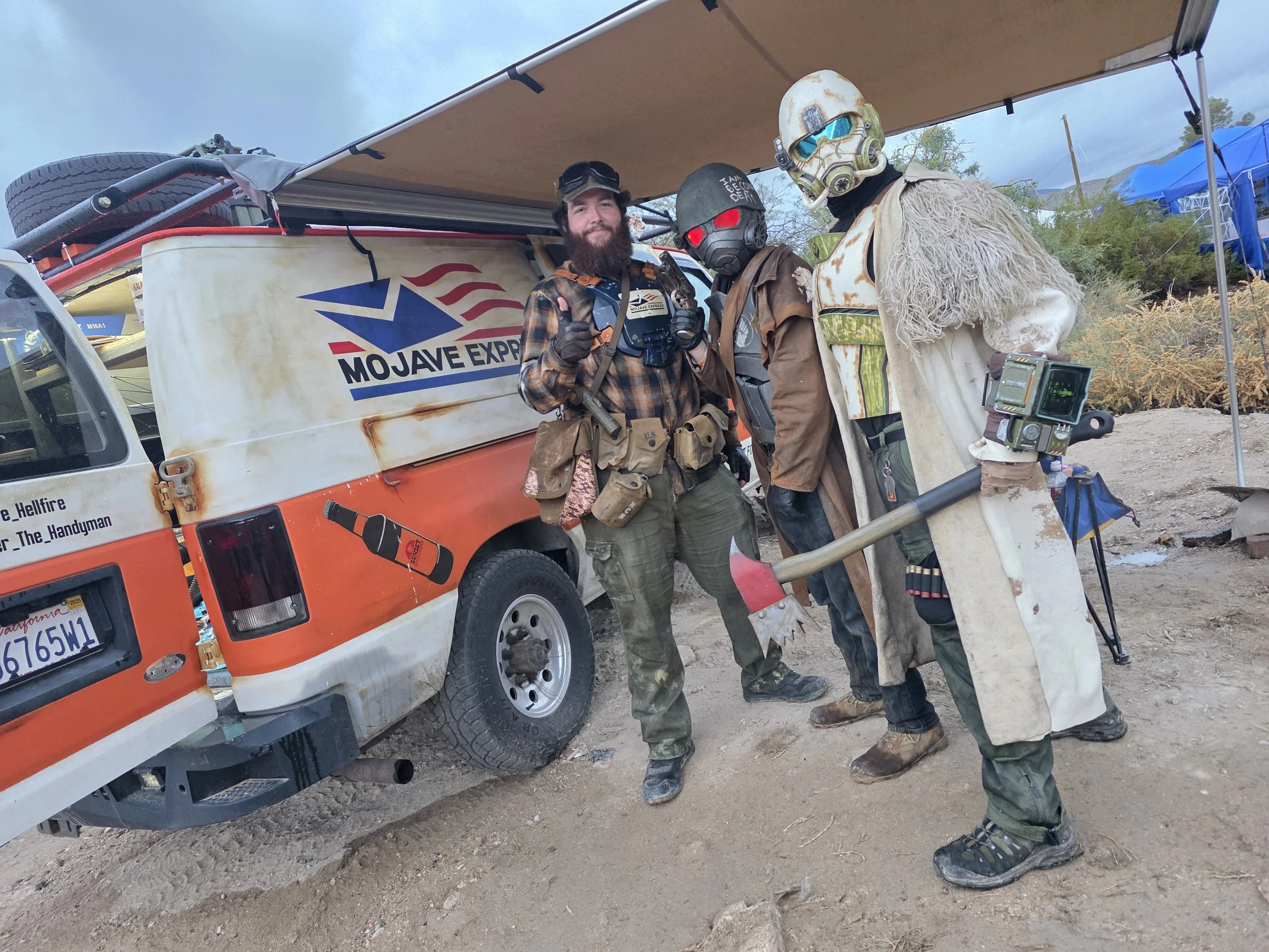 Mike with rangers taking shelter by the van