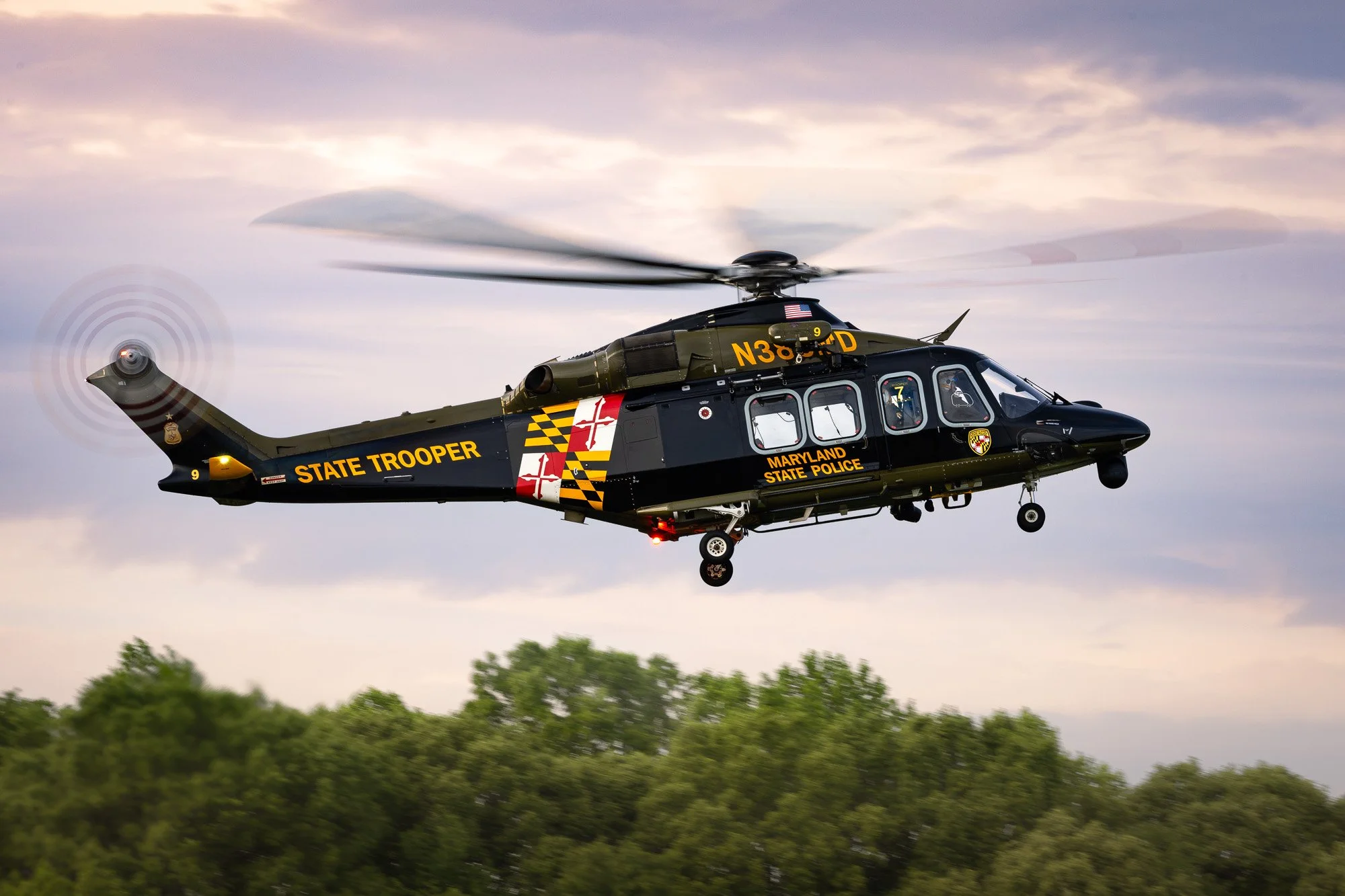 Leonardo AW139 (N389MD), callsign Trooper 7, operated by the Maryland State Police Aviation Command (MSPAC), comes in for a landing at St. Mary’s County Regional Airport (2W6) with a beautiful sunset sky backdrop.