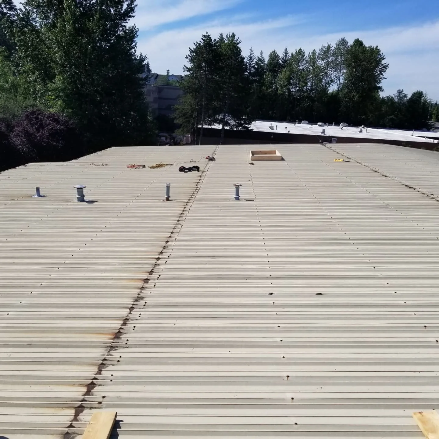 Metal roof overlay using EPS foam flute filler and GAF TPO
#waweathershield 
#gaftpo 
#woodinvillewa