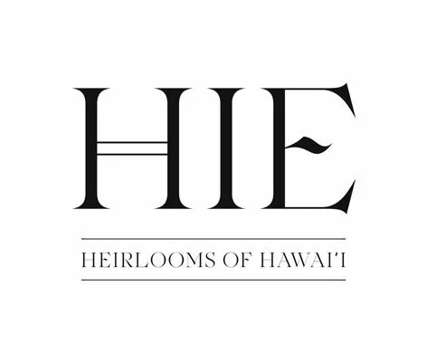 Logo with the text 'HIE' and the smaller slogan 'Heirlooms of Hawai'i' underneath.