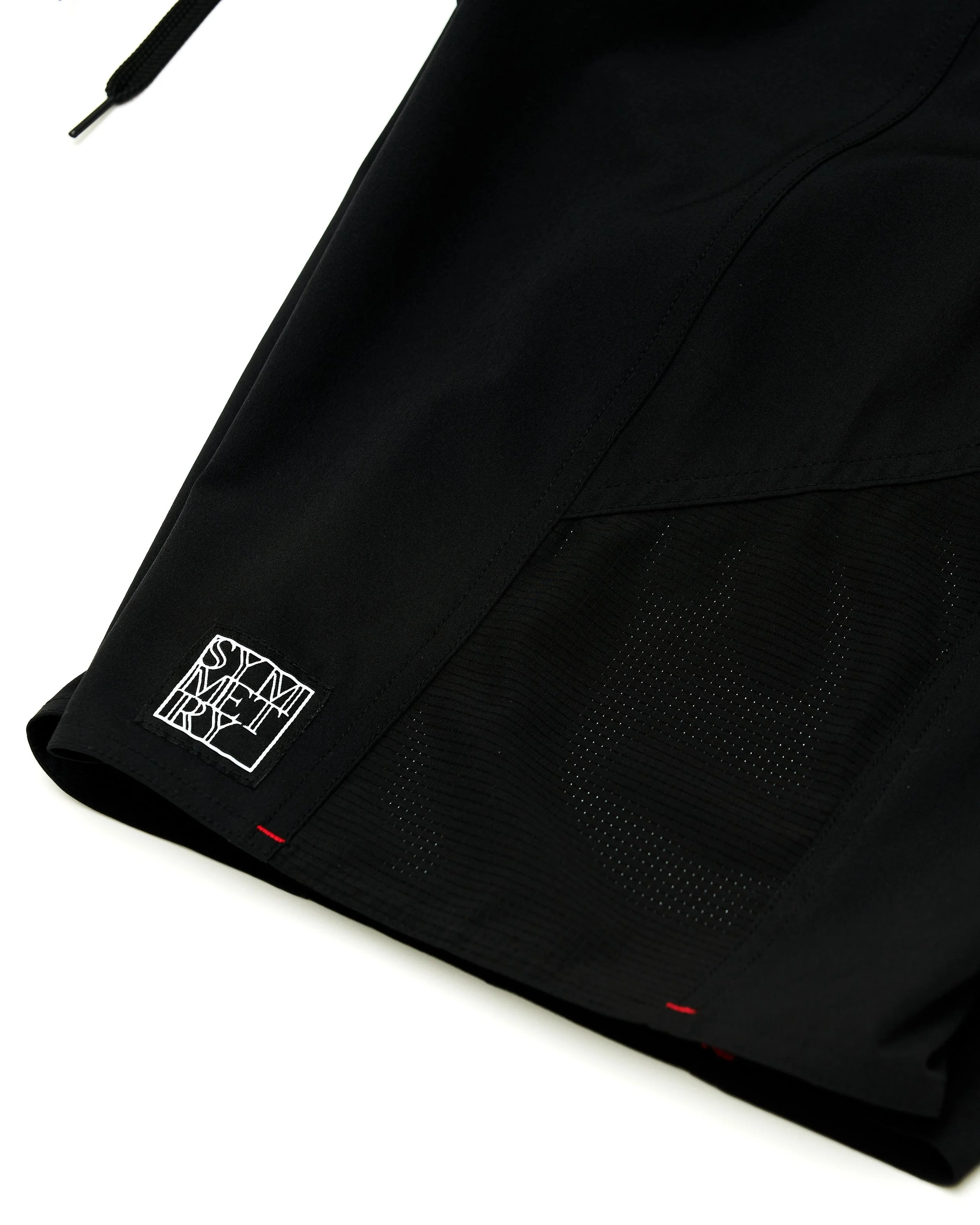 Close-up of a black bag with a white stitched logo reading 'SHINEMETRE' on the fabric.