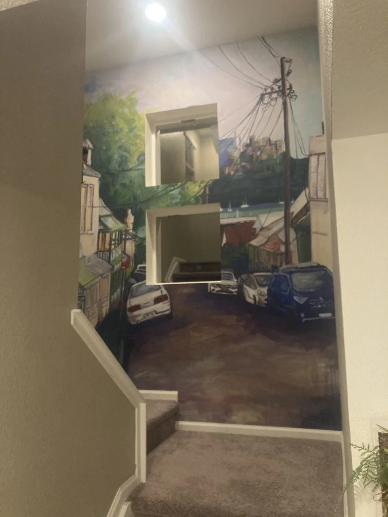 The lovely mural staircase welcomes you