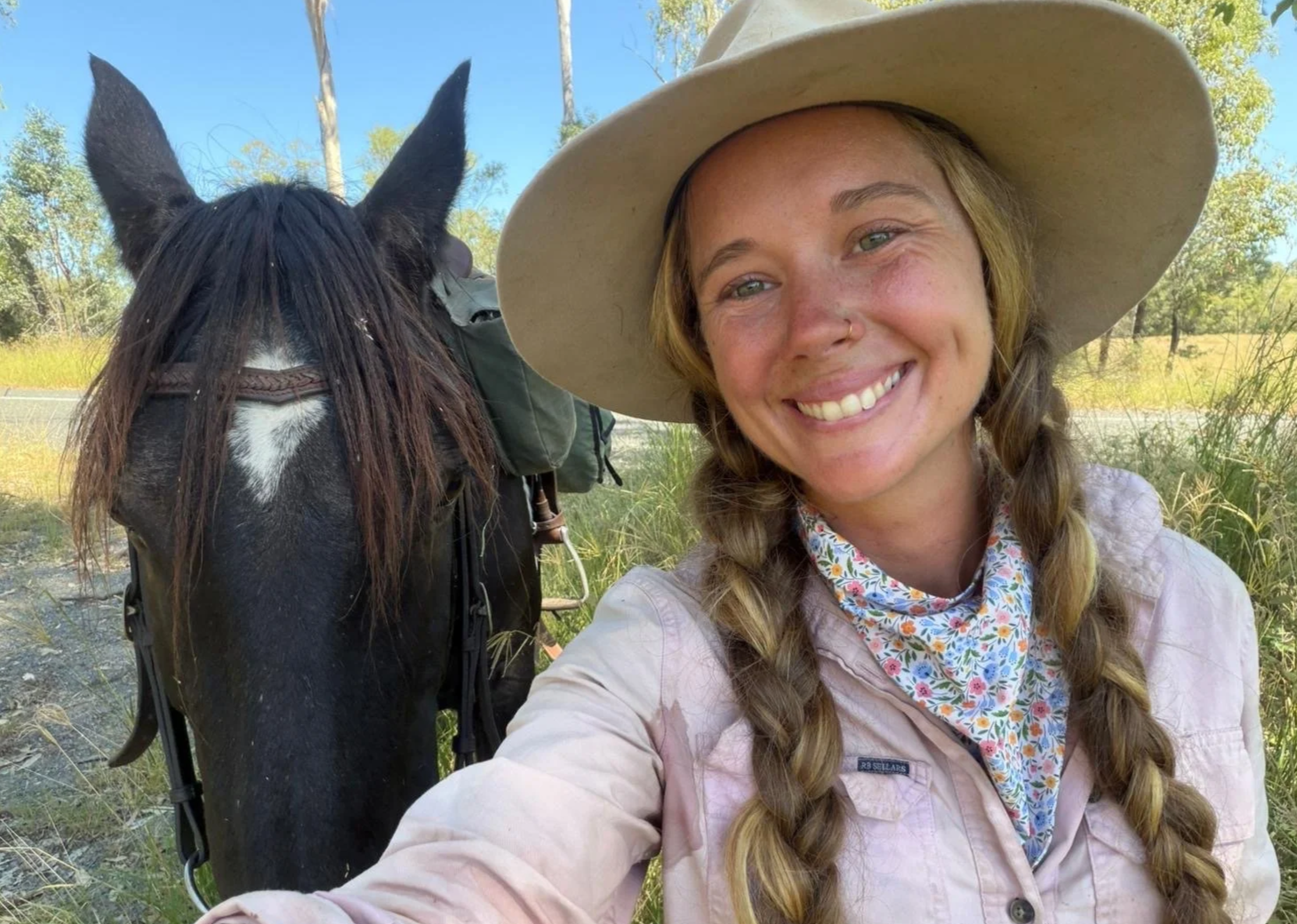 Nikki wearing the Rural Rays Flower Shop neck scarf. Designed for long days outdoors. Sits neatly under a collar, moves with you, and keeps the Queensland sun off the skin that matters most. The National Trail Australia. Horse Trekking Australia