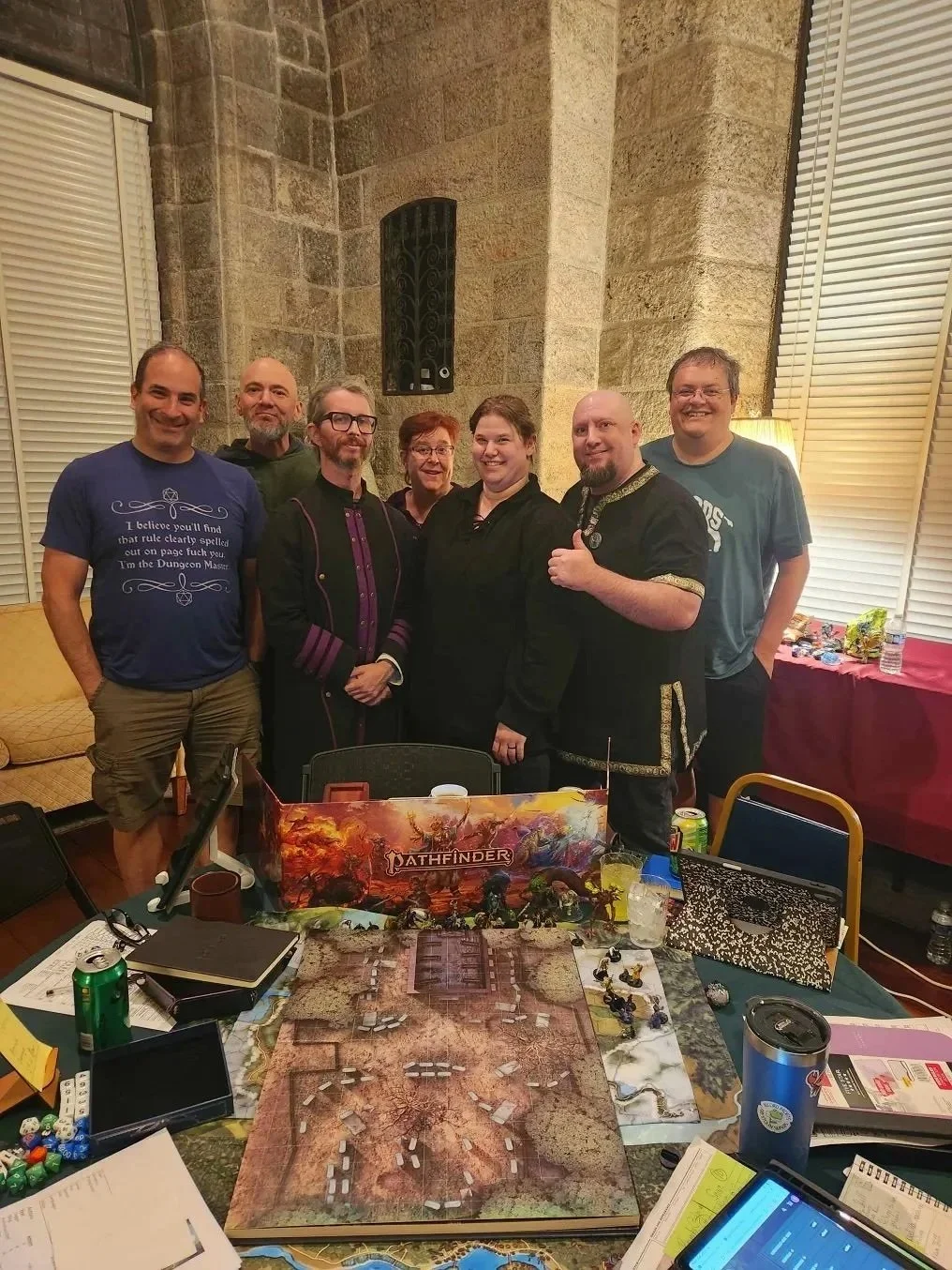 Players and a game master running an immersive tabletop RPG session in a castle setting, similar to Dungeons & Dragons, Pathfinder, World of Darkness, and Call of Cthulhu.