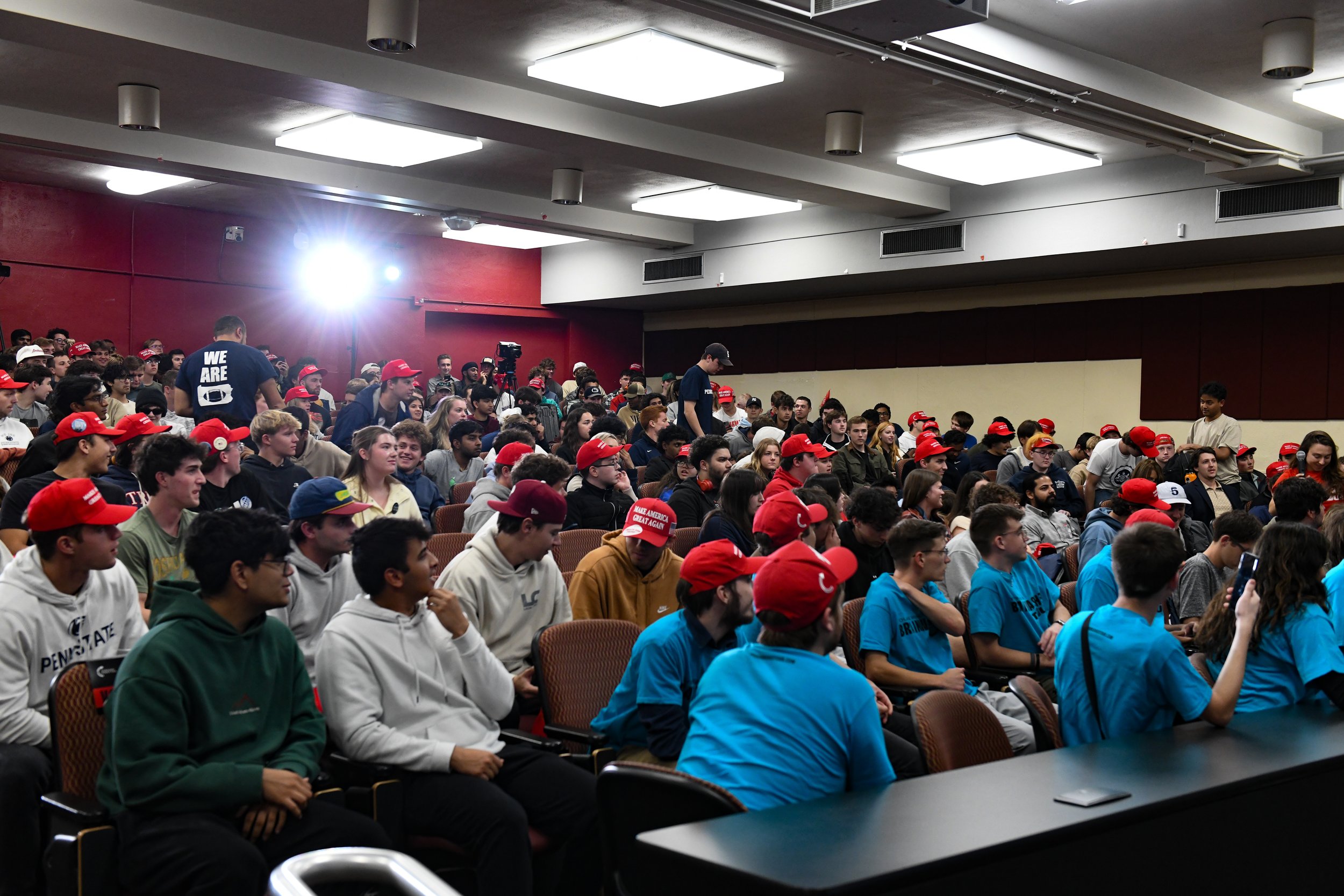 Members of the audience rise to ask Vivek Ramaswami questions during the "You're Being Brainwashed" tour on Thursday, Oct. 17, 2024, in University Park, Pa.