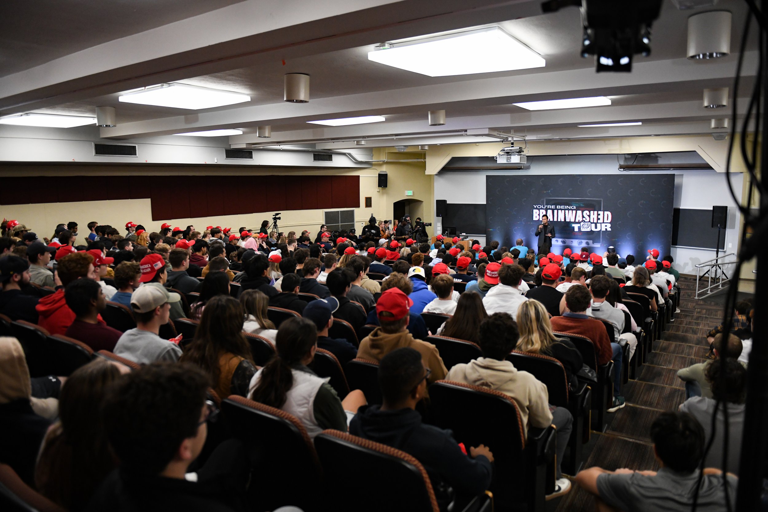 Penn State students listen to Vivek Ramaswamy deliver his talk during the "You're Being Brainwashed" tour on Thursday, Oct. 17, 2024, in University Park, Pa.
