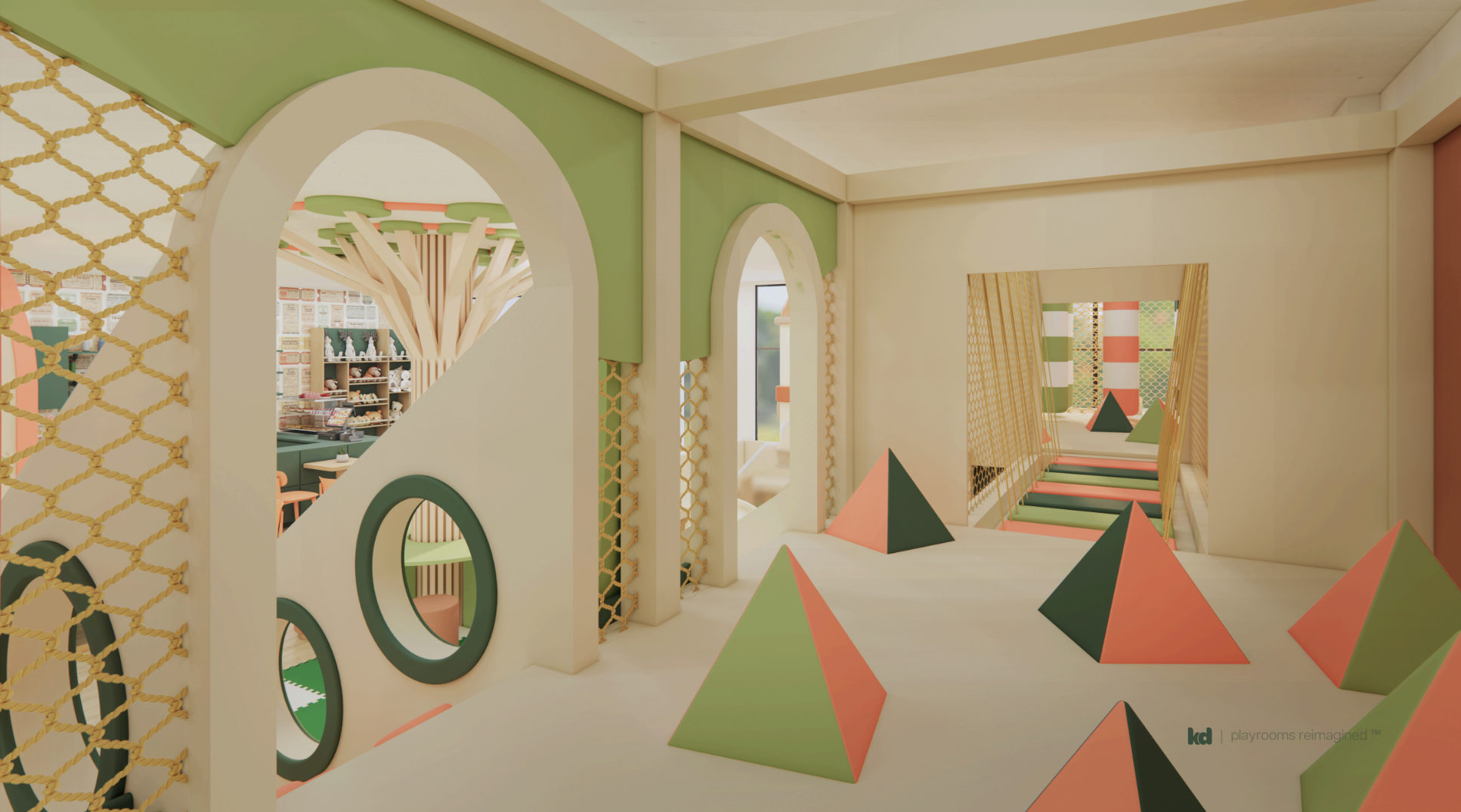 A climbing wall with porthole windows and a smooth slide creates endless fun. Adjacent is a quiet corner with high-top tables—ideal for working parents or supervision.