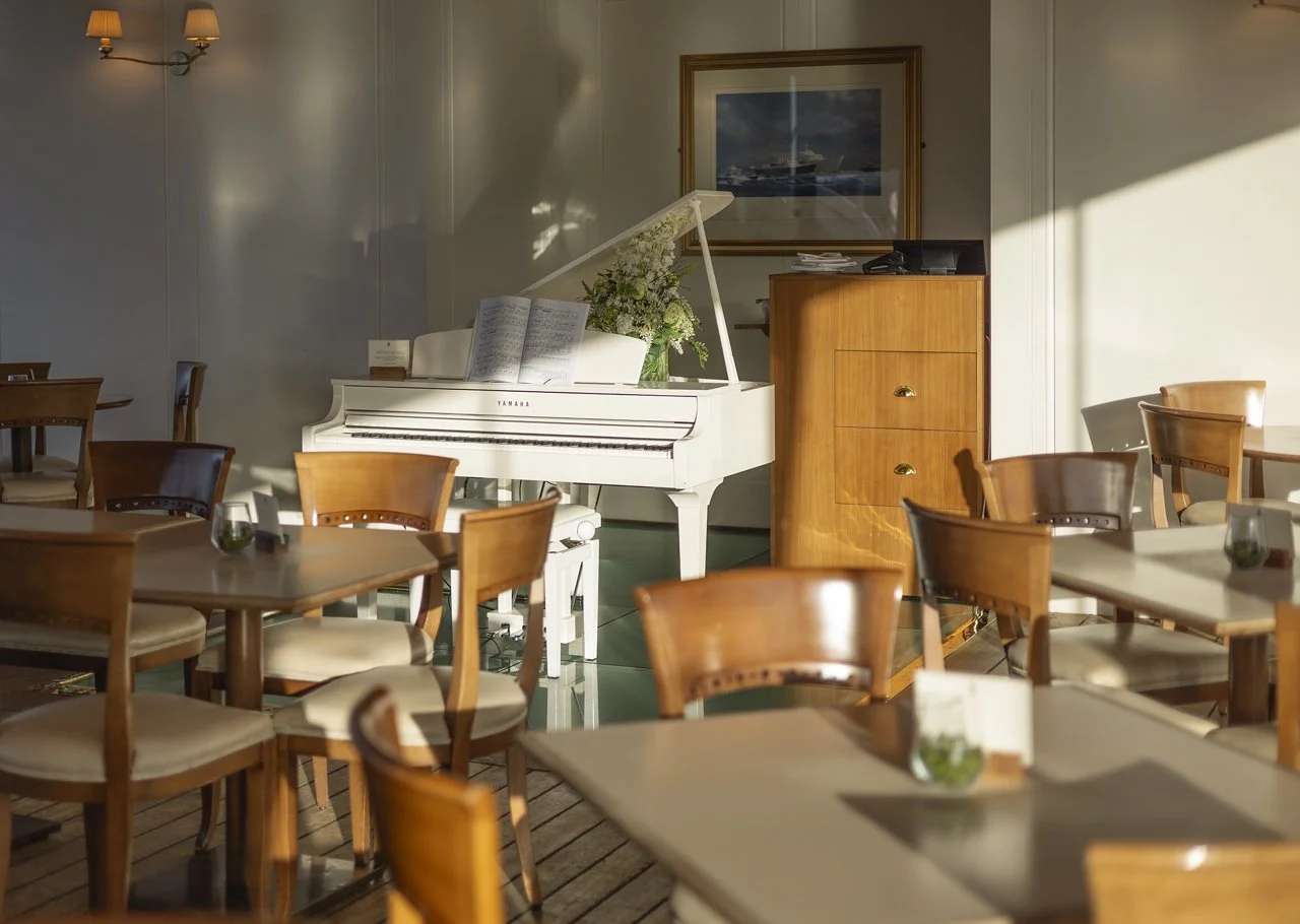 8-tearoom-sunlight-tables-piano (1).jpg