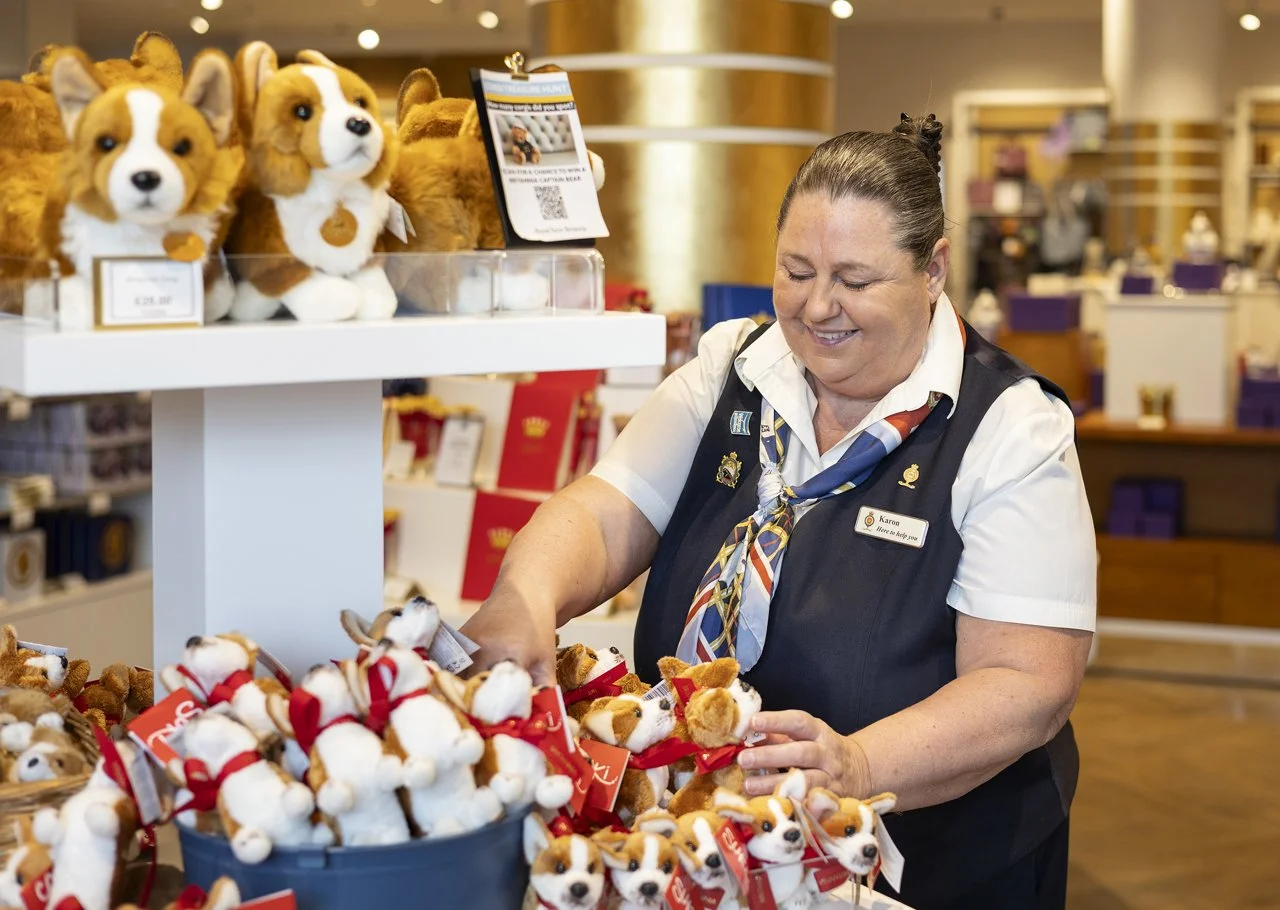 11-karon-restocking-the-corgi-display-in-the-shop.jpg
