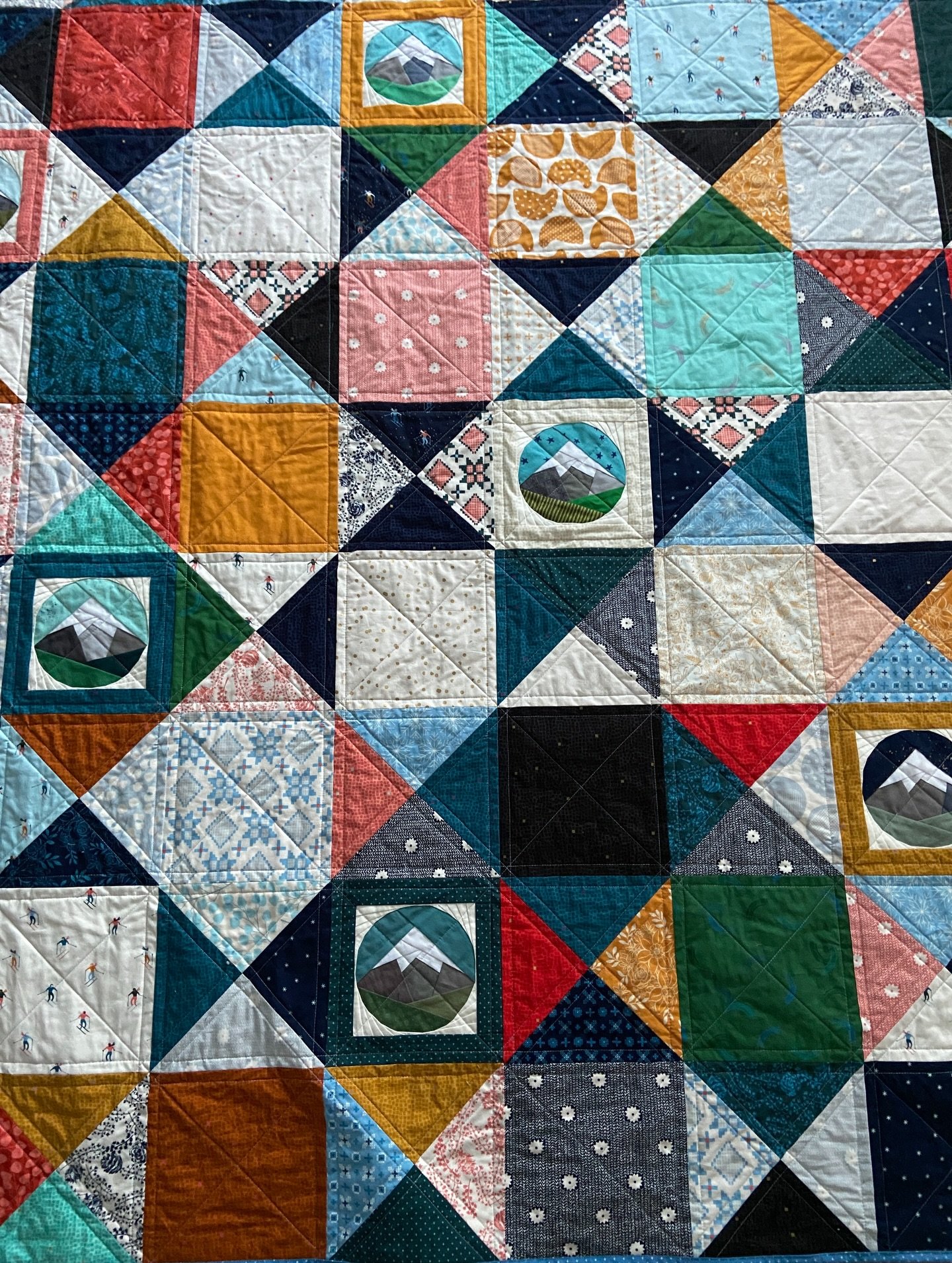 I realize I lied in my last post! I made more than just the two fish quilts this year. Back in January I made this custom mountain &amp; outsdoorsy winter quilt! It&rsquo;s one of the most satisfying quilt gifts I&rsquo;ve ever given because it&rsquo