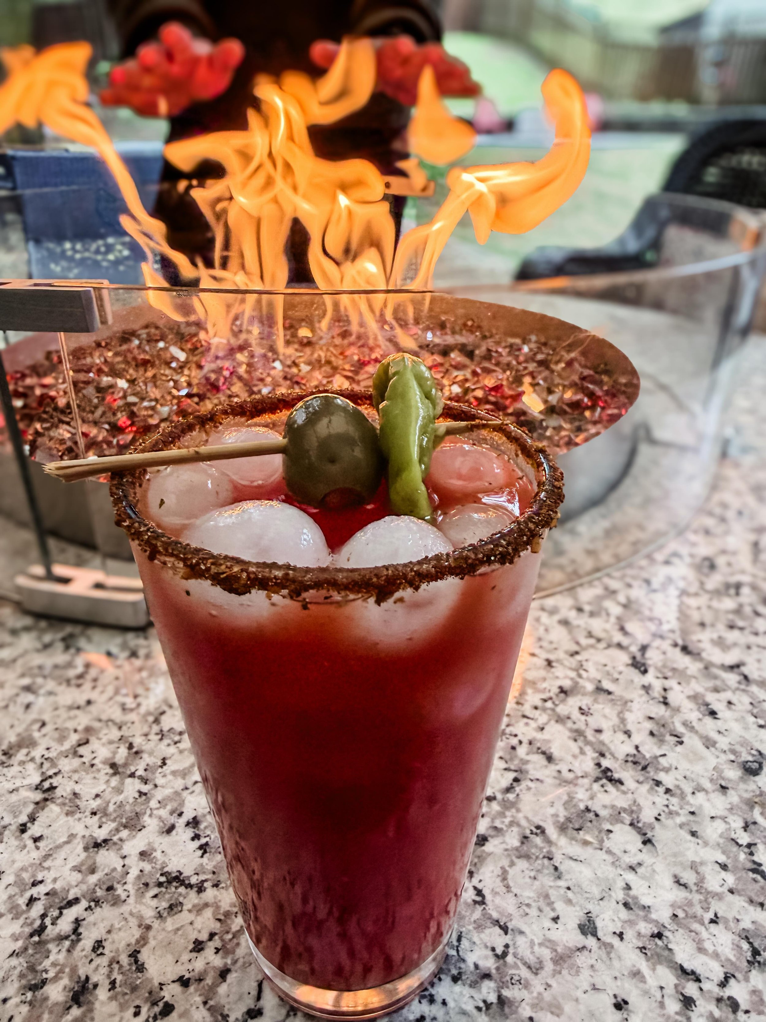 The forecast: smoky with a strong chance of Caesars.🔥🥫🍅 Cottage cocktail season is officially here! 🎉