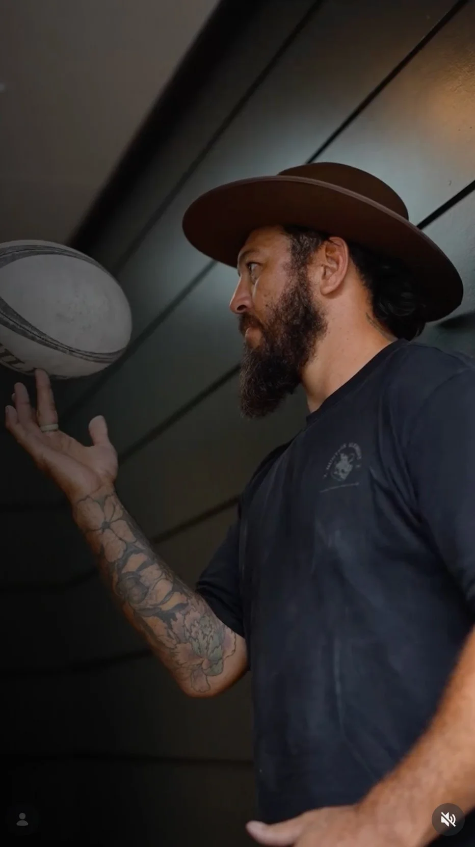 Image of Rene Ranger with a rugby ball balanced on his fingers.