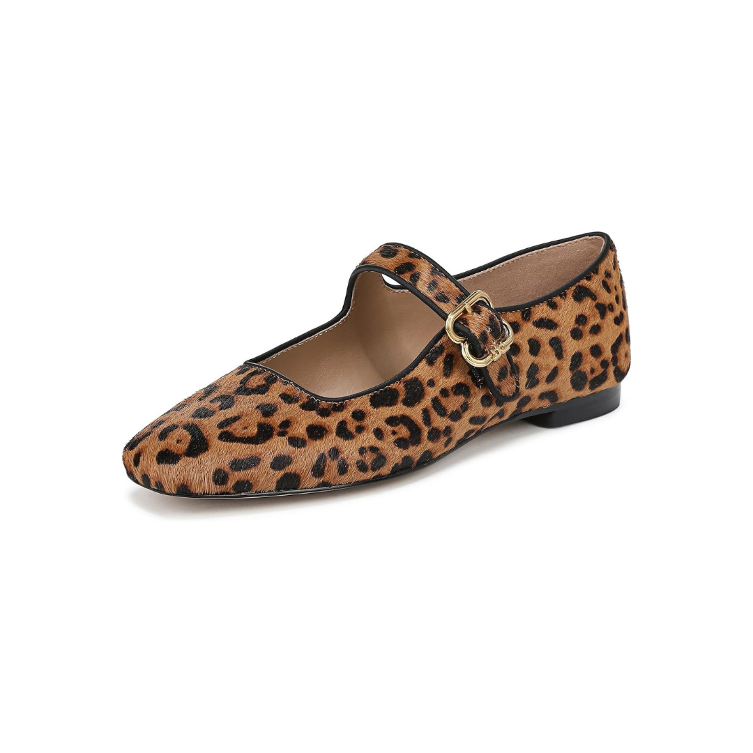 Leopard print Mary Jane flat with black trim and a gold buckle.