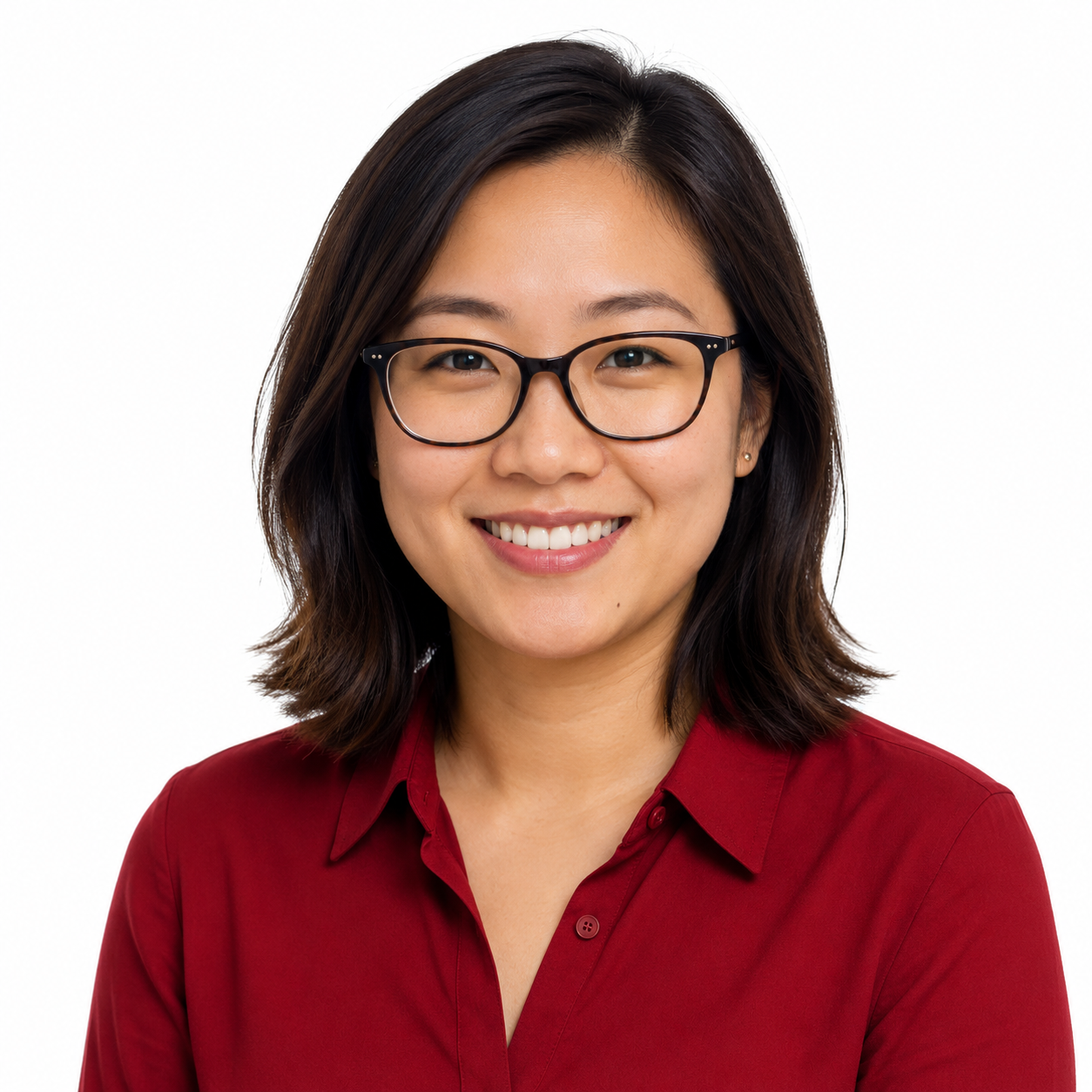 30-something Asian woman with shoulder-length hair, glasses, and a crimson collared shirt