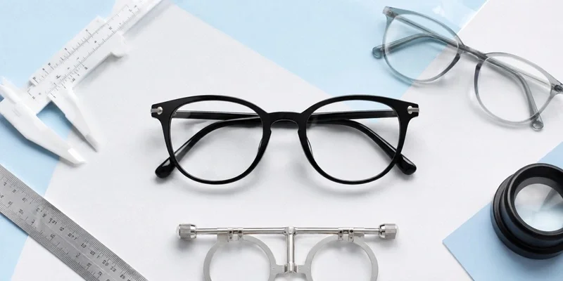 Optometry tools and eyeglasses flat lay
