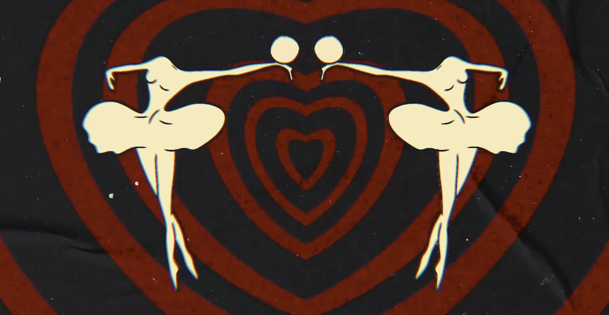 two ballerinas juggle their heads in front of a hypnotic heart pattern