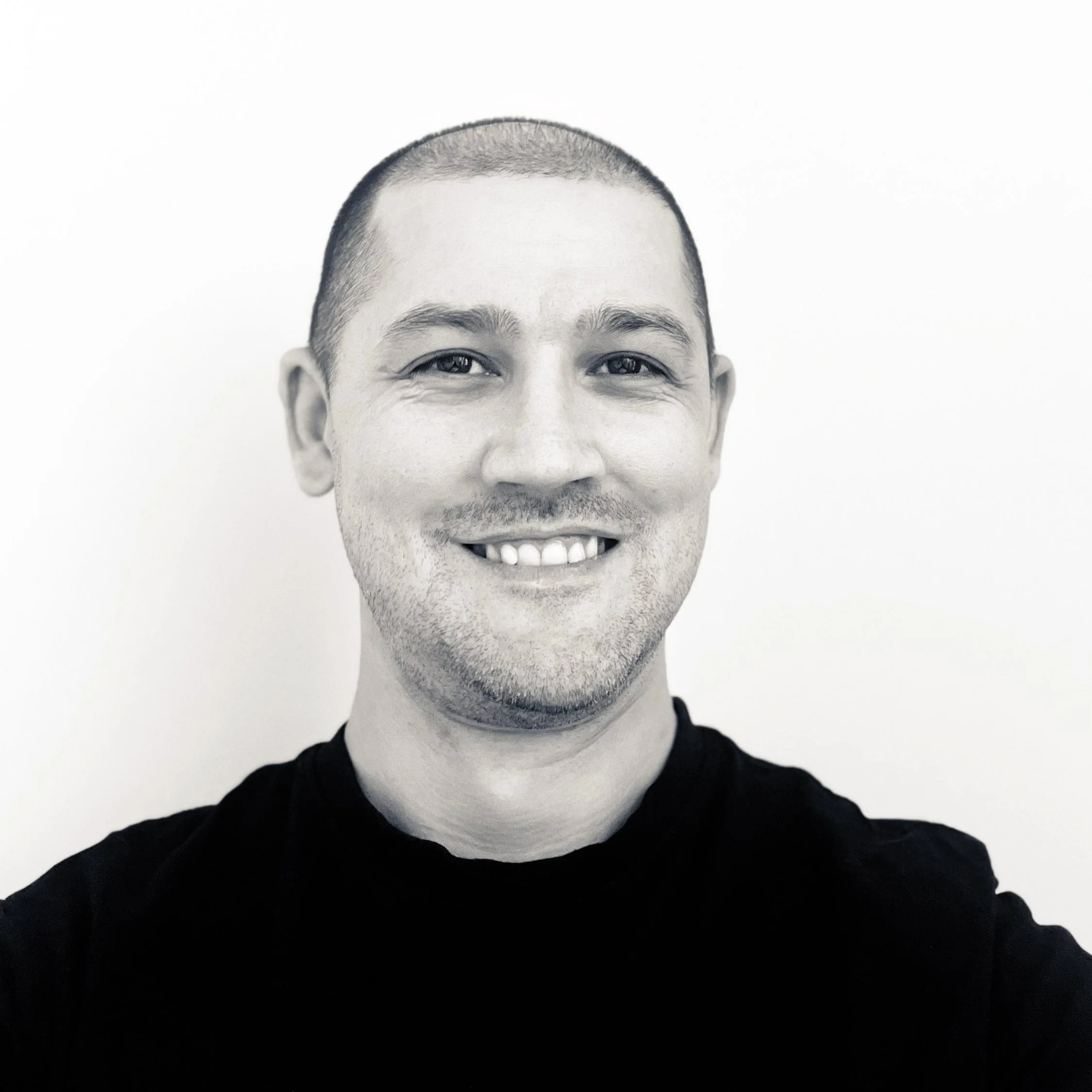 Black and white portrait of Johnny, Strathpine landscape designer specialising in residential gardens, outdoor makeovers, and planting design across Brisbane North.