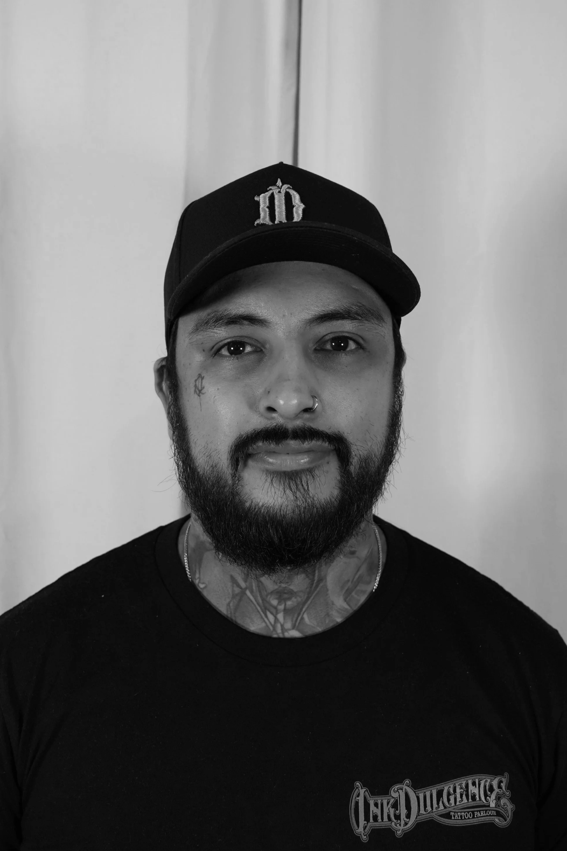 Alex, senior tattoo artist at Inkdulgence Tattoo Parlour in Marden, Adelaide, specialising in realism, portraits, fine line, blackwork, anime and custom tattoos.