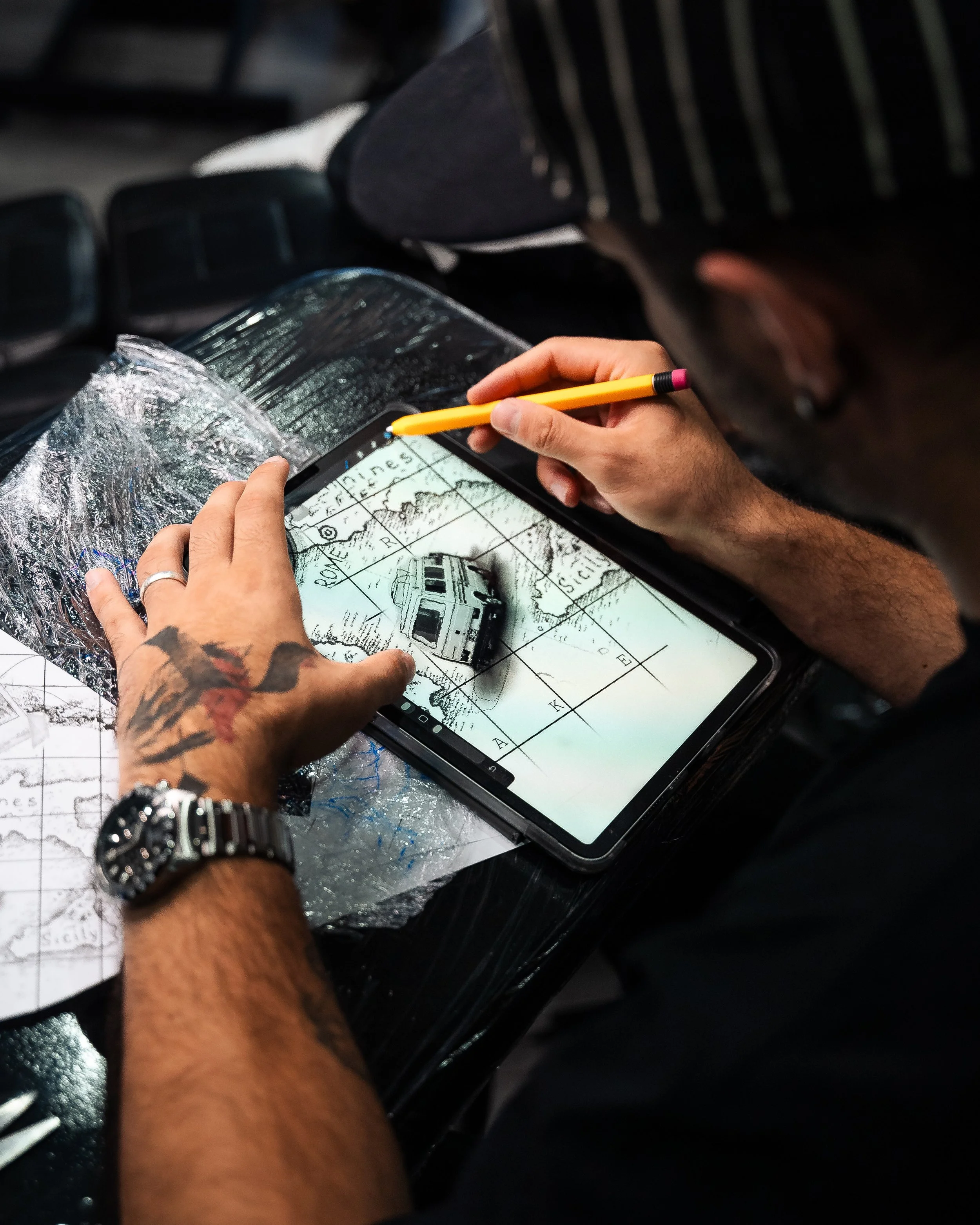 Close up image of Tattoo Artist Designing a Custom Design Tattoo