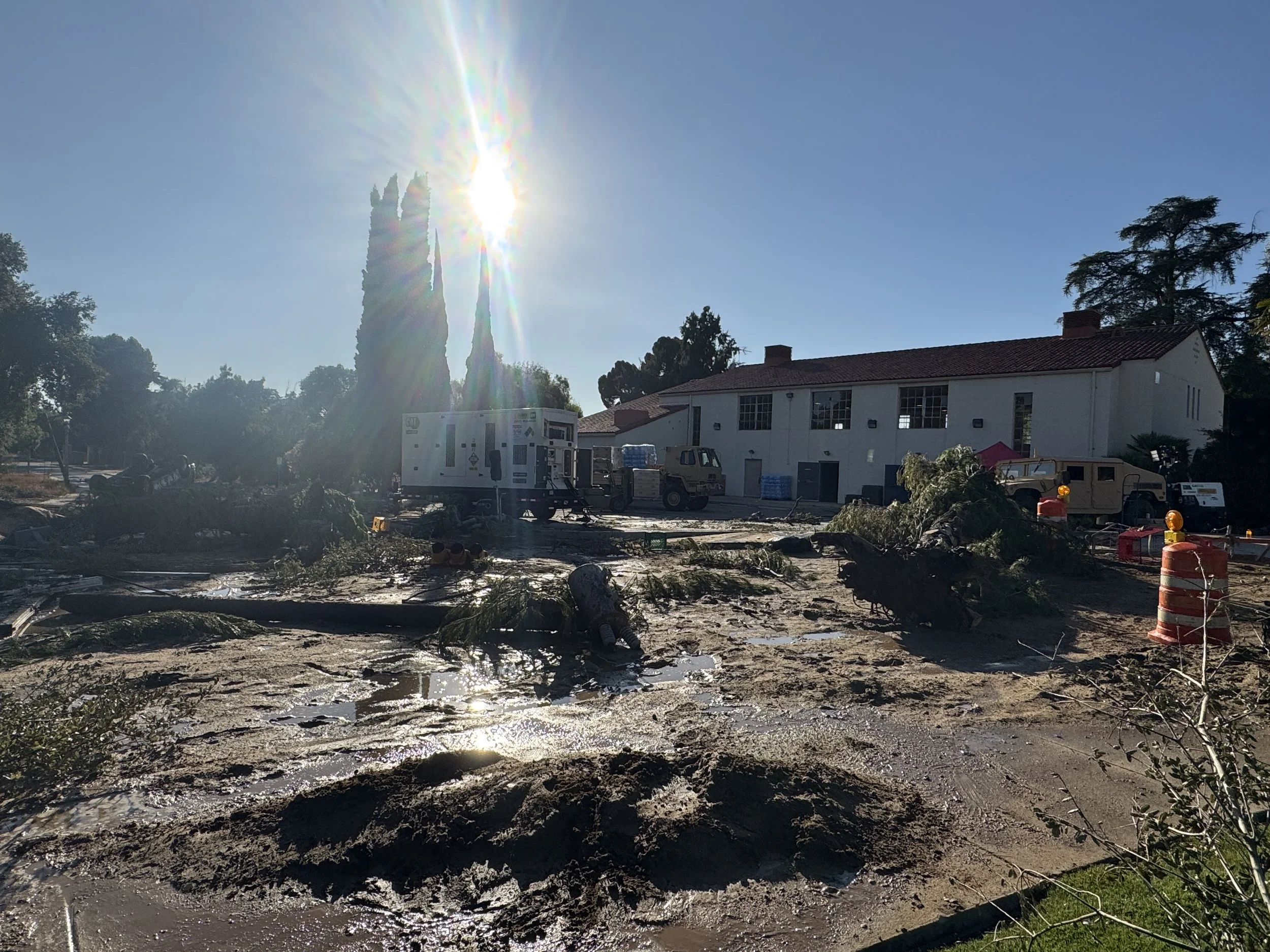 The idea was to change this location into a post hurricane+flood disaster area. We laid down 5 tonnes of mud, dressed in downed trees, power poles and various other debris, flipped and damaged cars, and brought in military vehicles.
