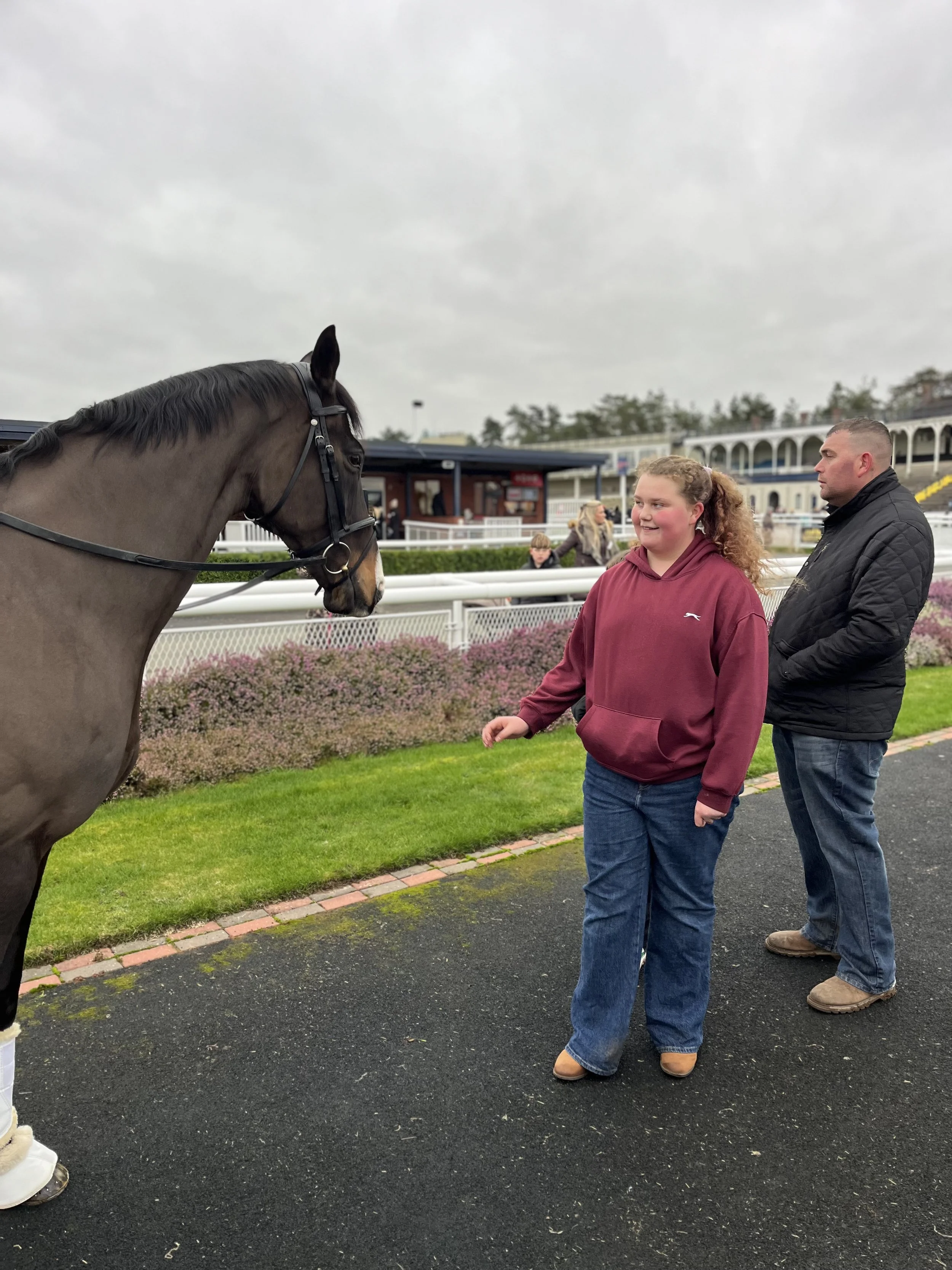 A special moment in the paddock as a young racegoer meets one of the horses up close during the Behind the Scenes Race Day at Ludlow Racecourse.