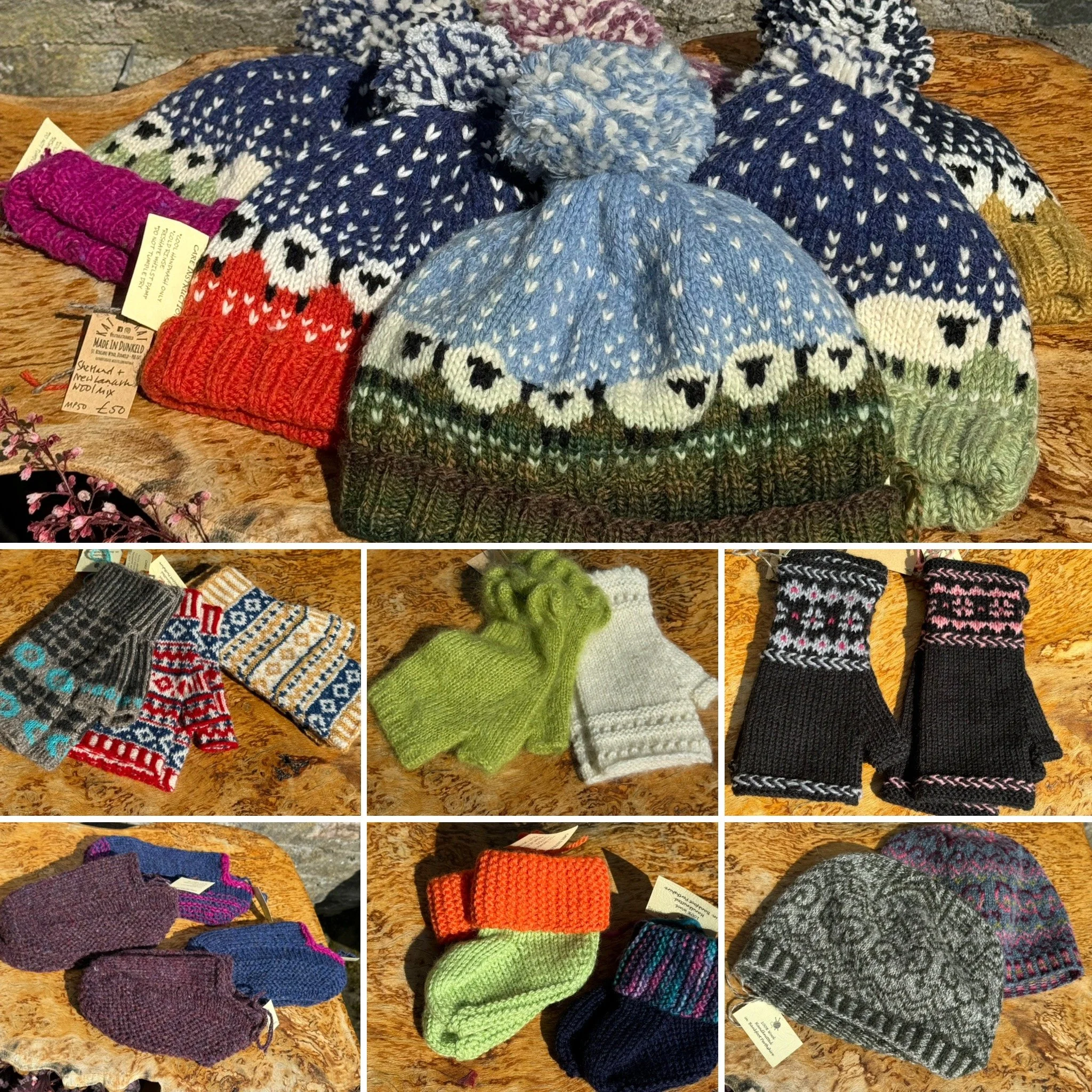Various colorful knitted hats, scarves, gloves, and mittens displayed on a wooden surface.