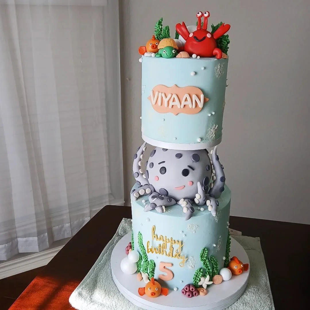 Under the Sea 🫧🐠🐙

This is our first gravity defying cake! It was for an ocean themed birthday party held at an aquatic center - how fun is that?! 🥽

This cake had an 8&quot; tier of real cake on the bottom, a fondant octopus with a styrofoam sph