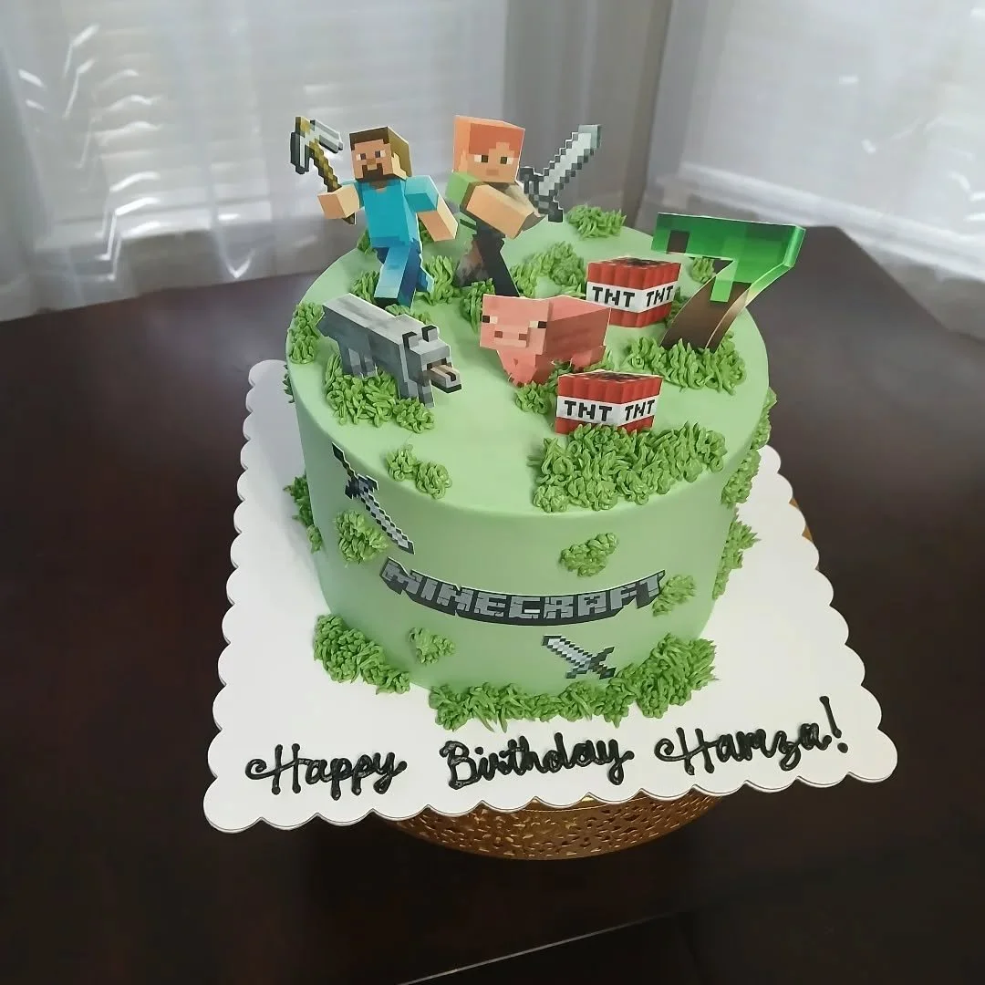 Minecraft Cake &amp; Cookies! 

This 8&quot; cake and sugar cookies set was a lot of fun to put together! It features a lot of edible images with chocolate backing and piped buttercream &quot;grass&quot; designs for a fully edible AND cool set!

Send
