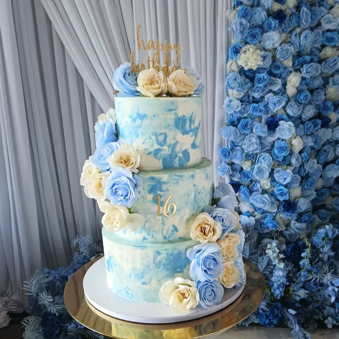Blooms in Blue 💙🤍

A sweet cake and treat table for a sweet 16th!

The star of the show is the 3 tier cake with 8", 10", and 12" tiers featuring a blue and white watercolor effect across all tiers 💙 we also added soft ivory and dust