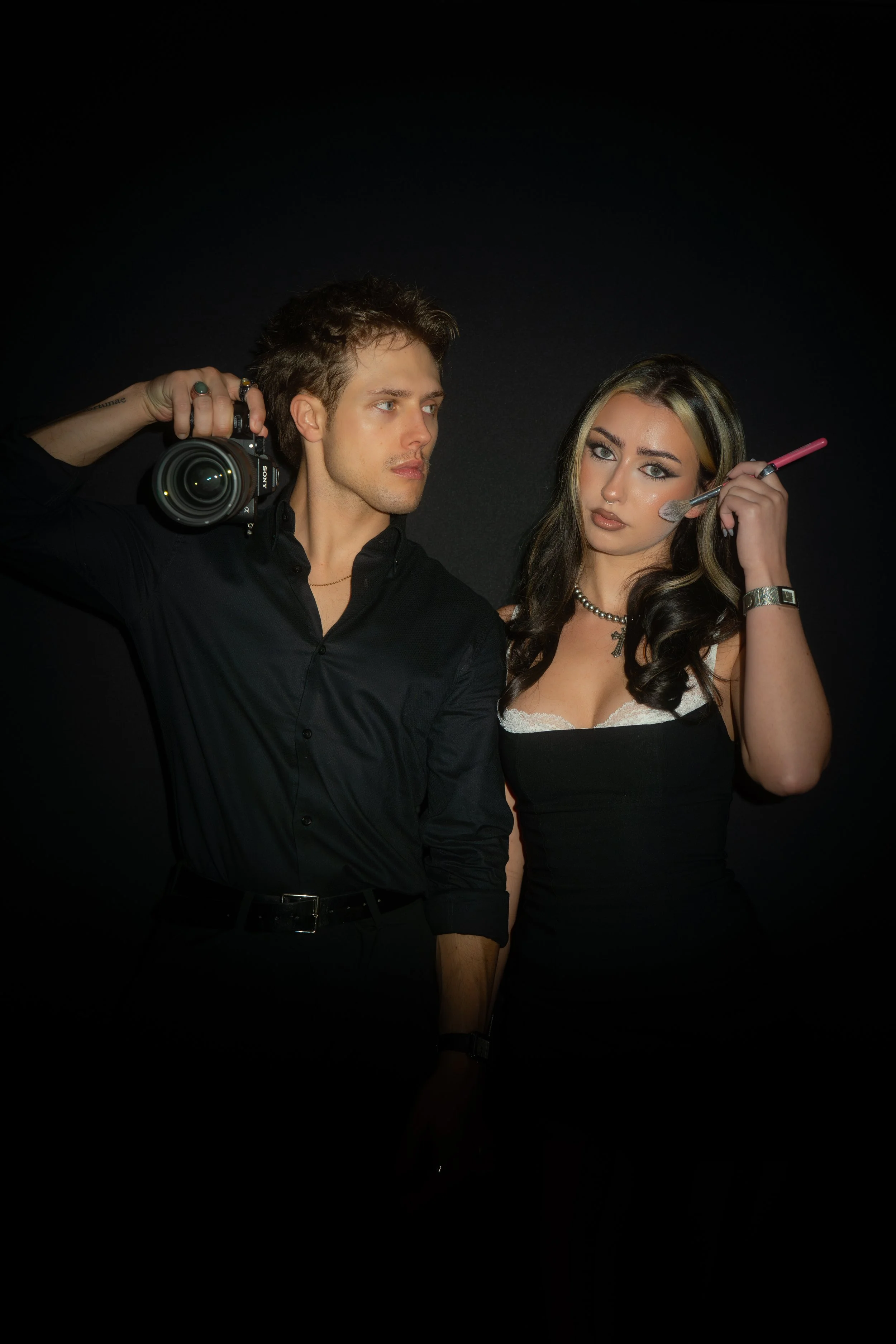 Pierce and Carrie Jane with camera and makeup brush
