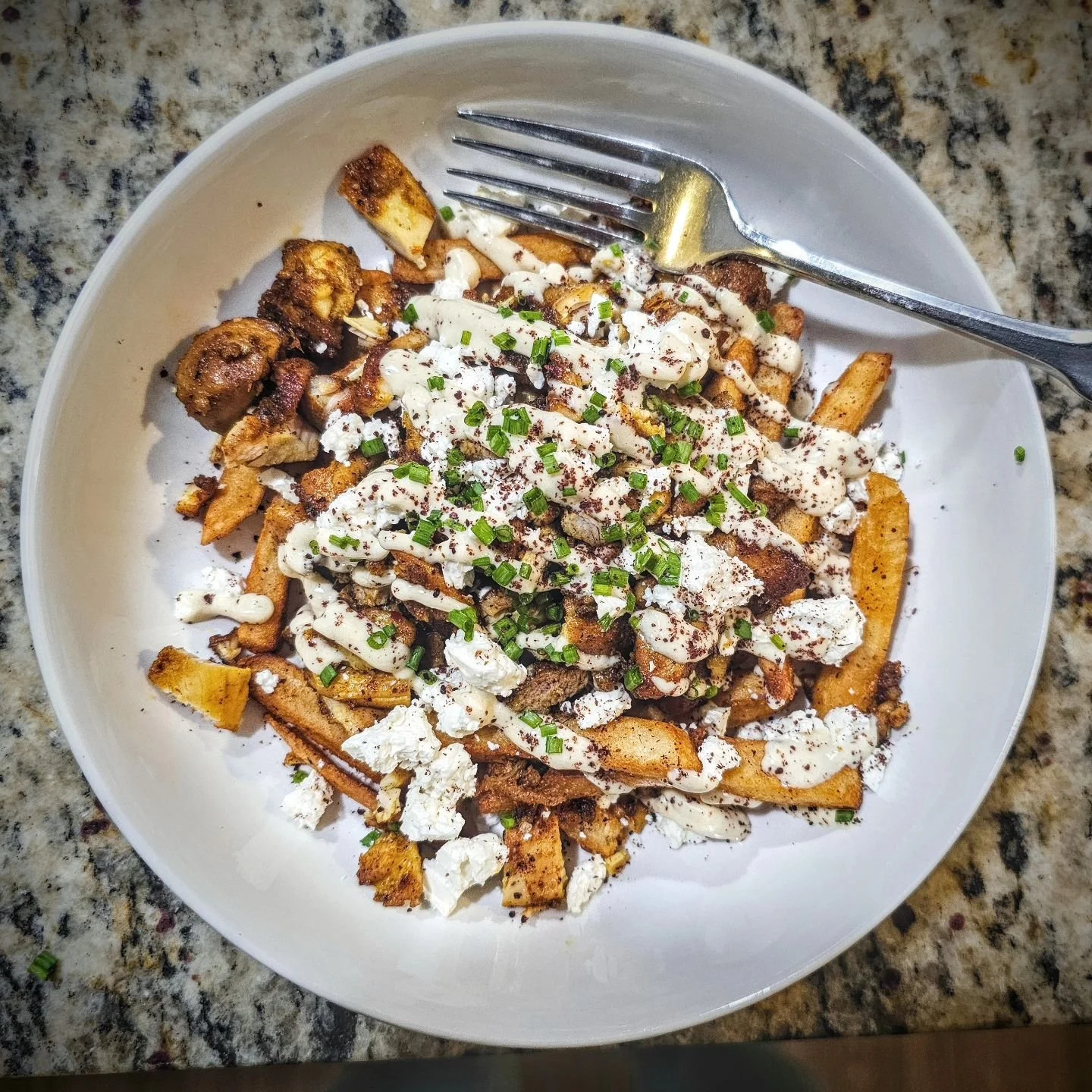 Chicken shawarma fries with feta and garlic sauce- heavily requested by my son for dinner tonight. :-D