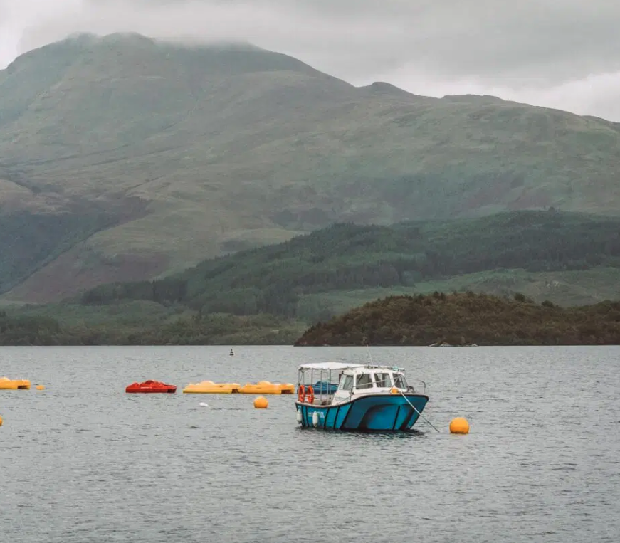 We are explorers. Text reads: Experiences Holidays Loch Lomond Scotland: Where The Highlands Meet The Lowlands